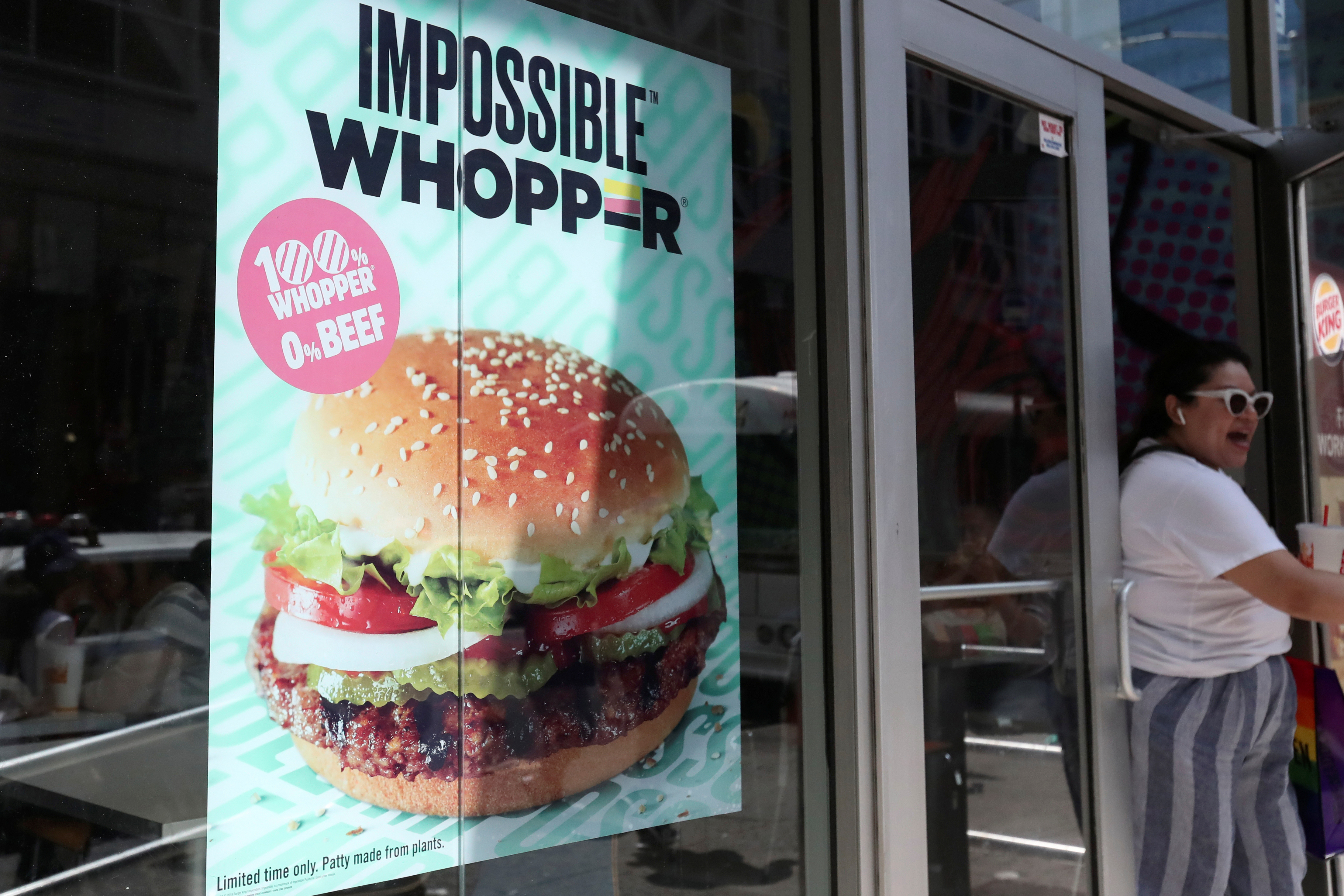 A sign advertising the soy based Impossible Whopper is seen outside a Burger King in New York