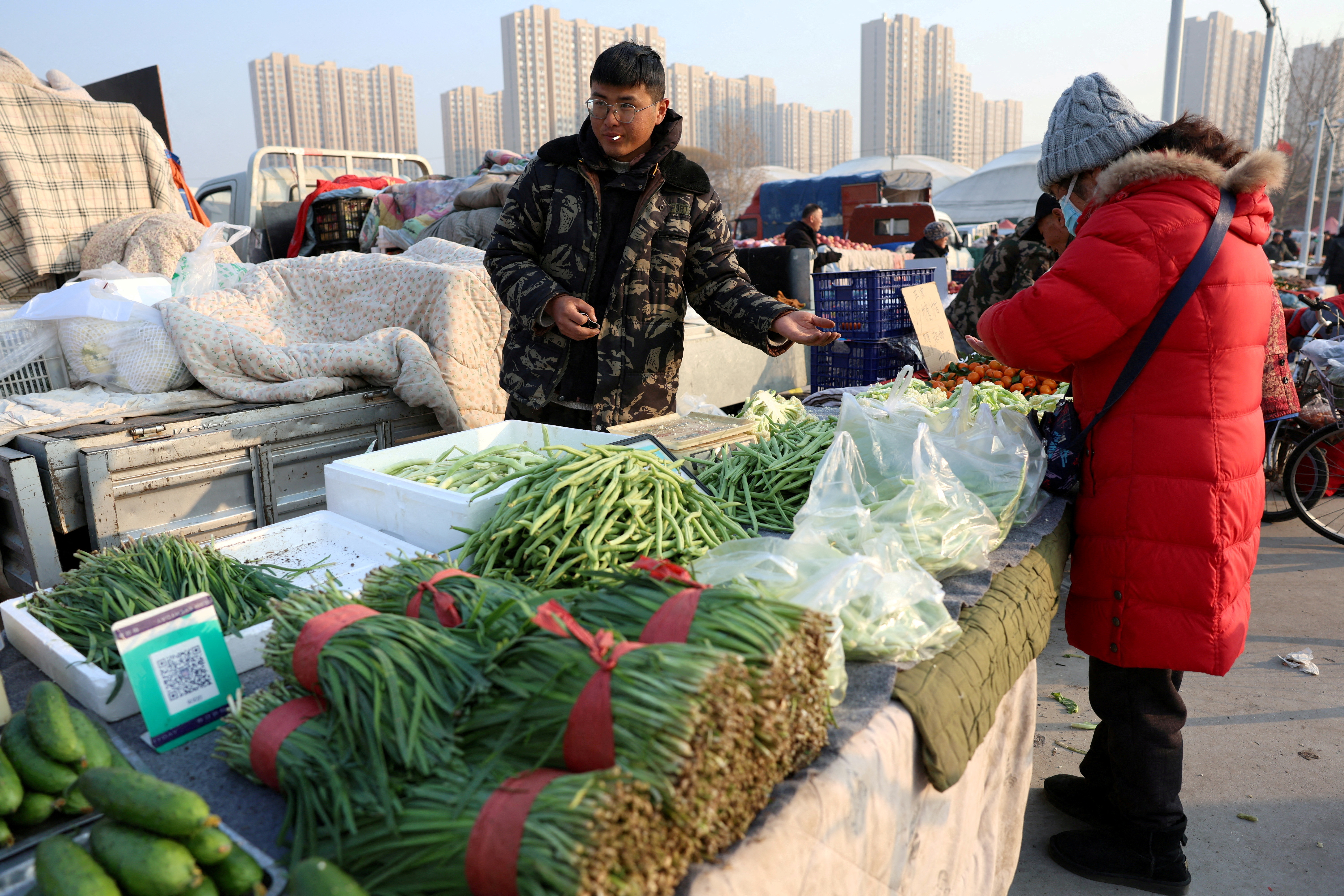 Vegetable vendor at market in Beijing