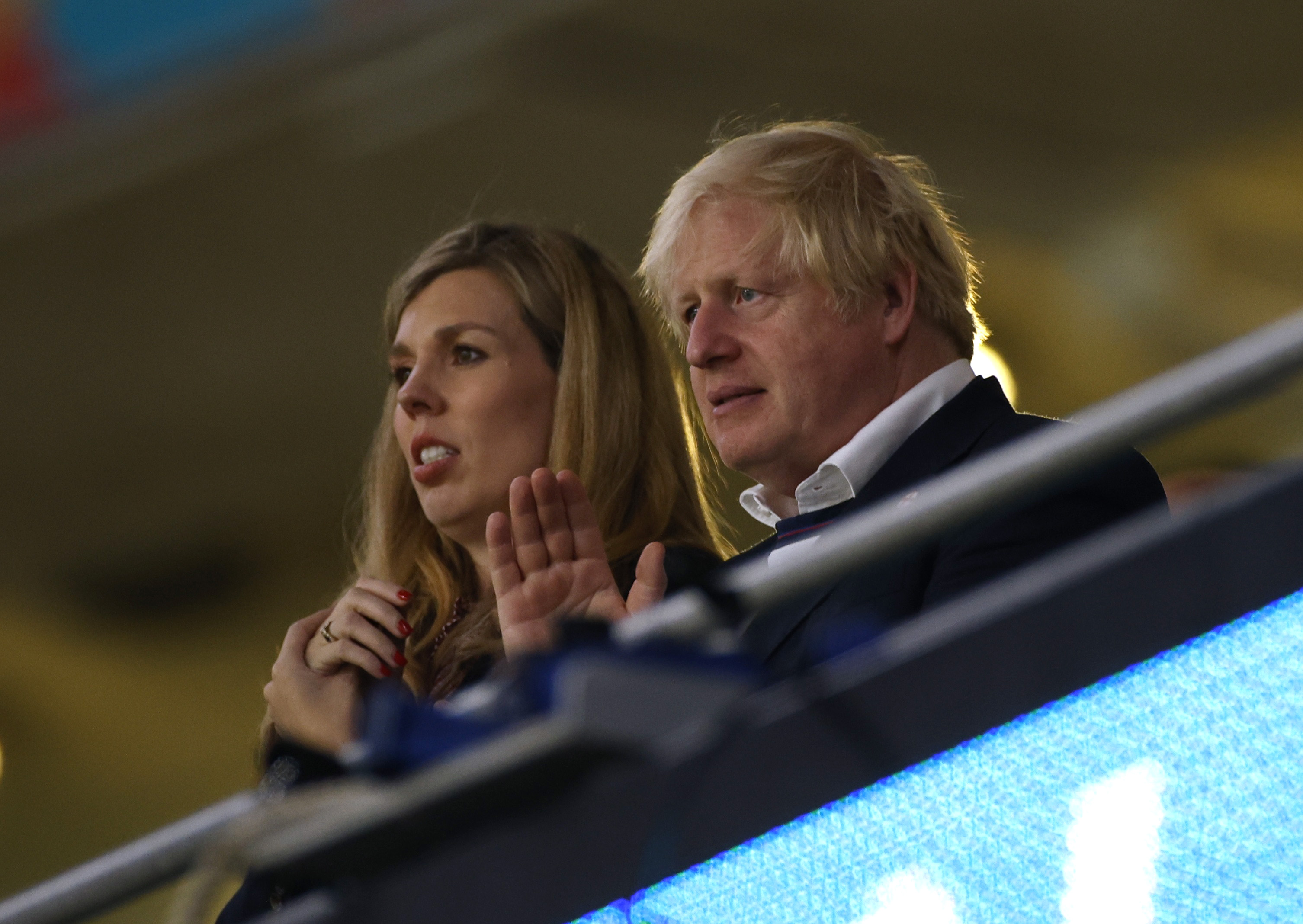 Soccer Football - Euro 2020 - Final - Italy v England - Wembley Stadium, London, Britain - July 11, 2021 Britain's Prime Minister Boris Johnson with his wife Carrie Johnson after the match Pool via REUTERS/John Sibley