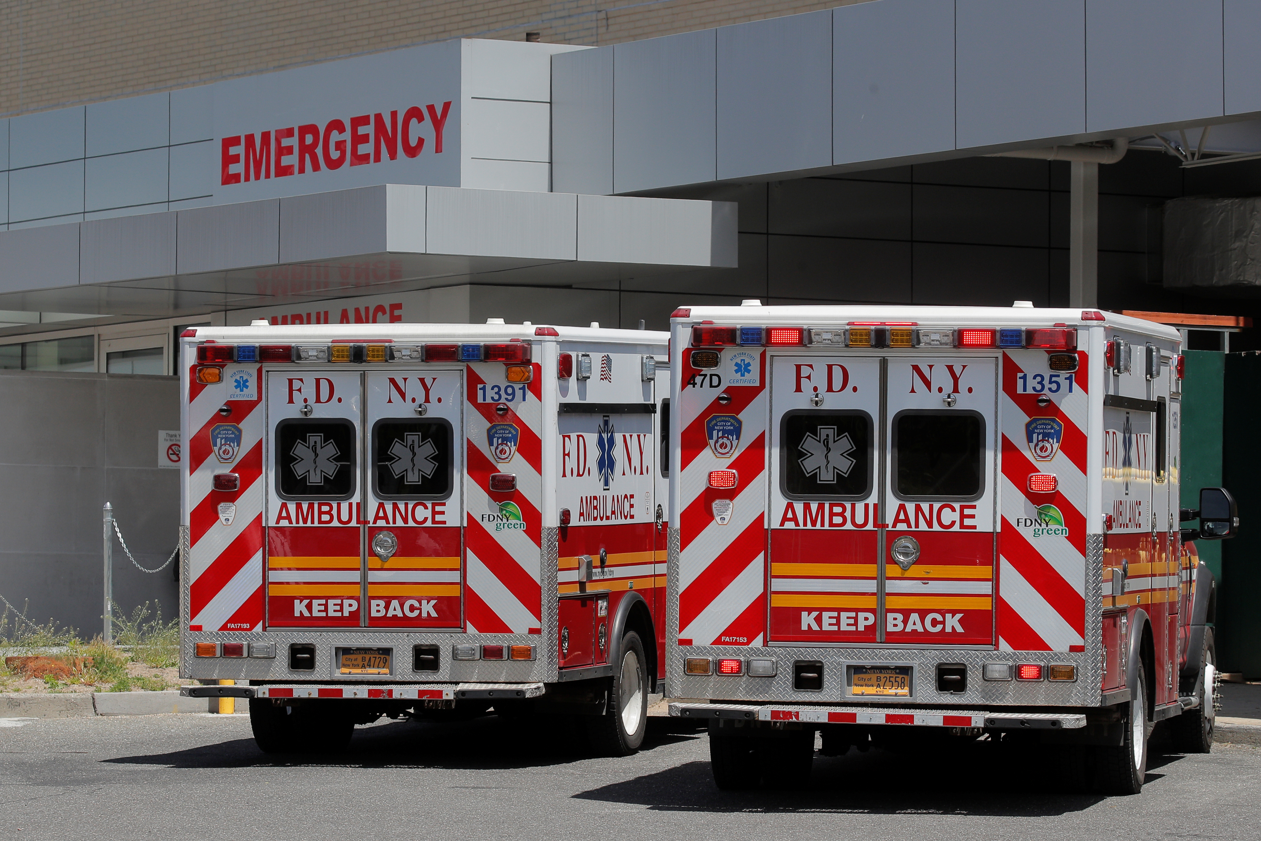 New York City Fire Department (FDNY) Ambulances are parked at the emergency entrance of St. John's Episcopal Hospital, during the outbreak of the coronavirus disease (COVID-19), in the Far Rockaway  section of Queens, New York