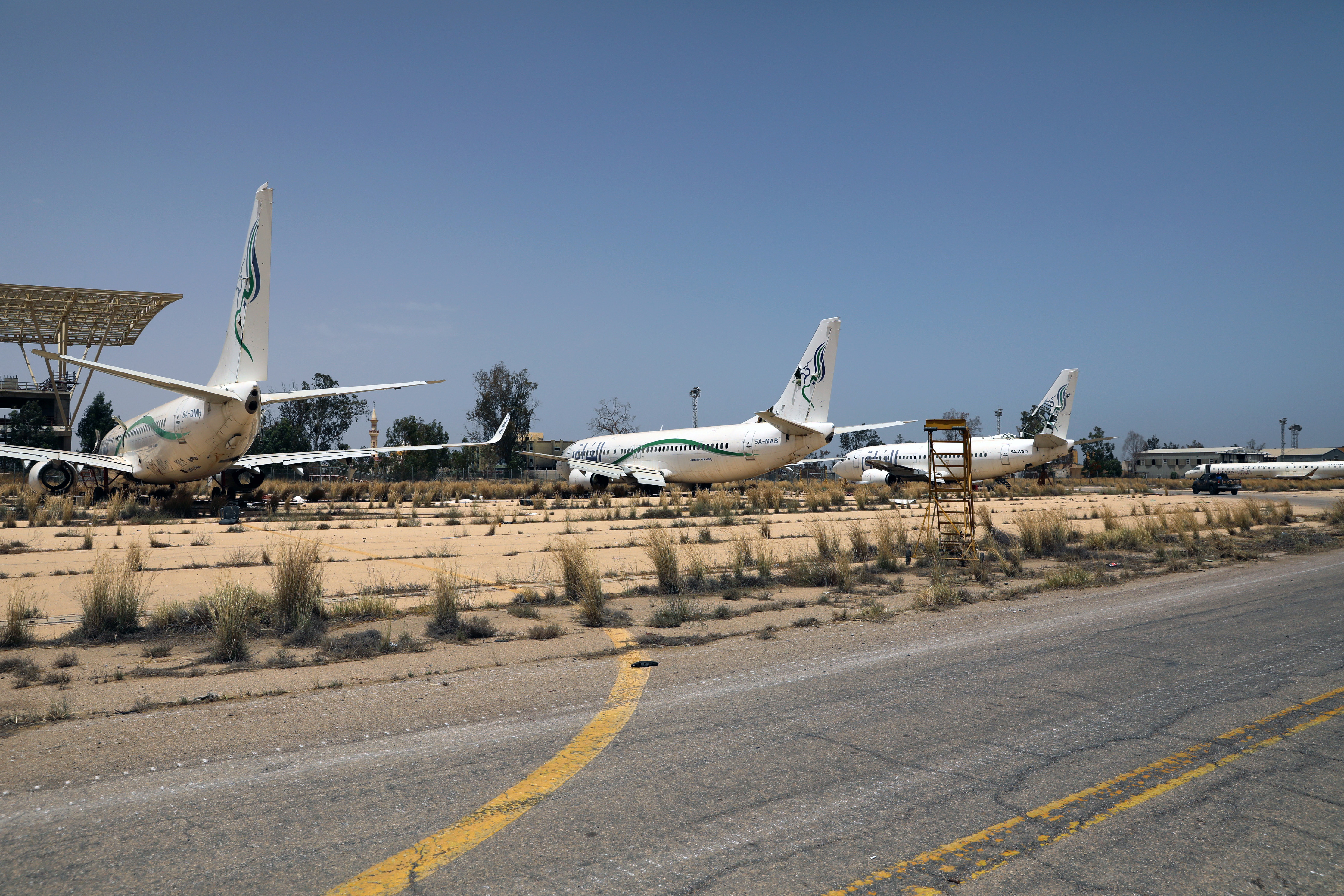 lAirplanes are seen at Tripoli airport after Libya's internationally recognised government regained control over the city, in Tripoli