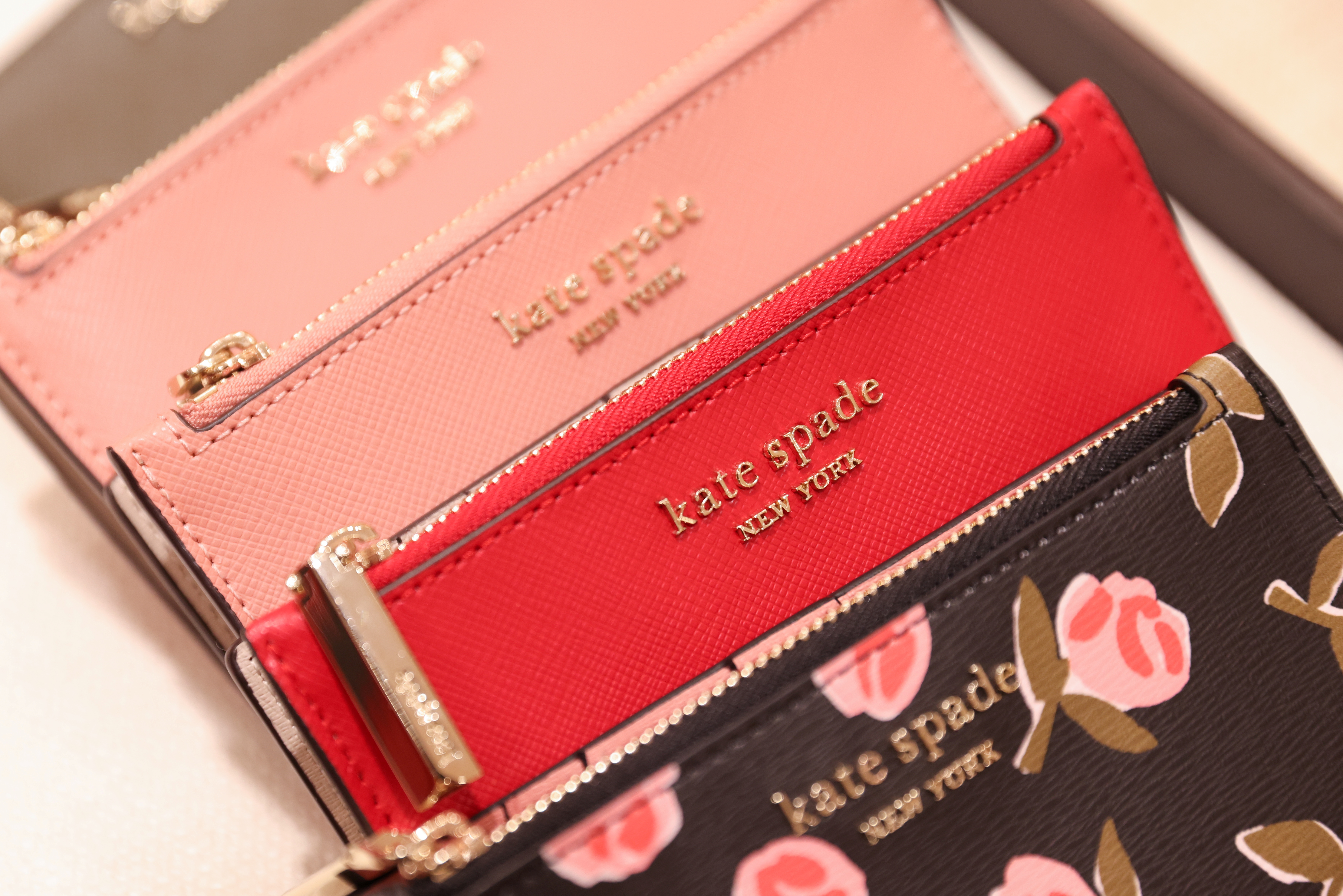 Items are seen in a Kate Spade store, owned by Tapestry, Inc., in Manhattan, New York