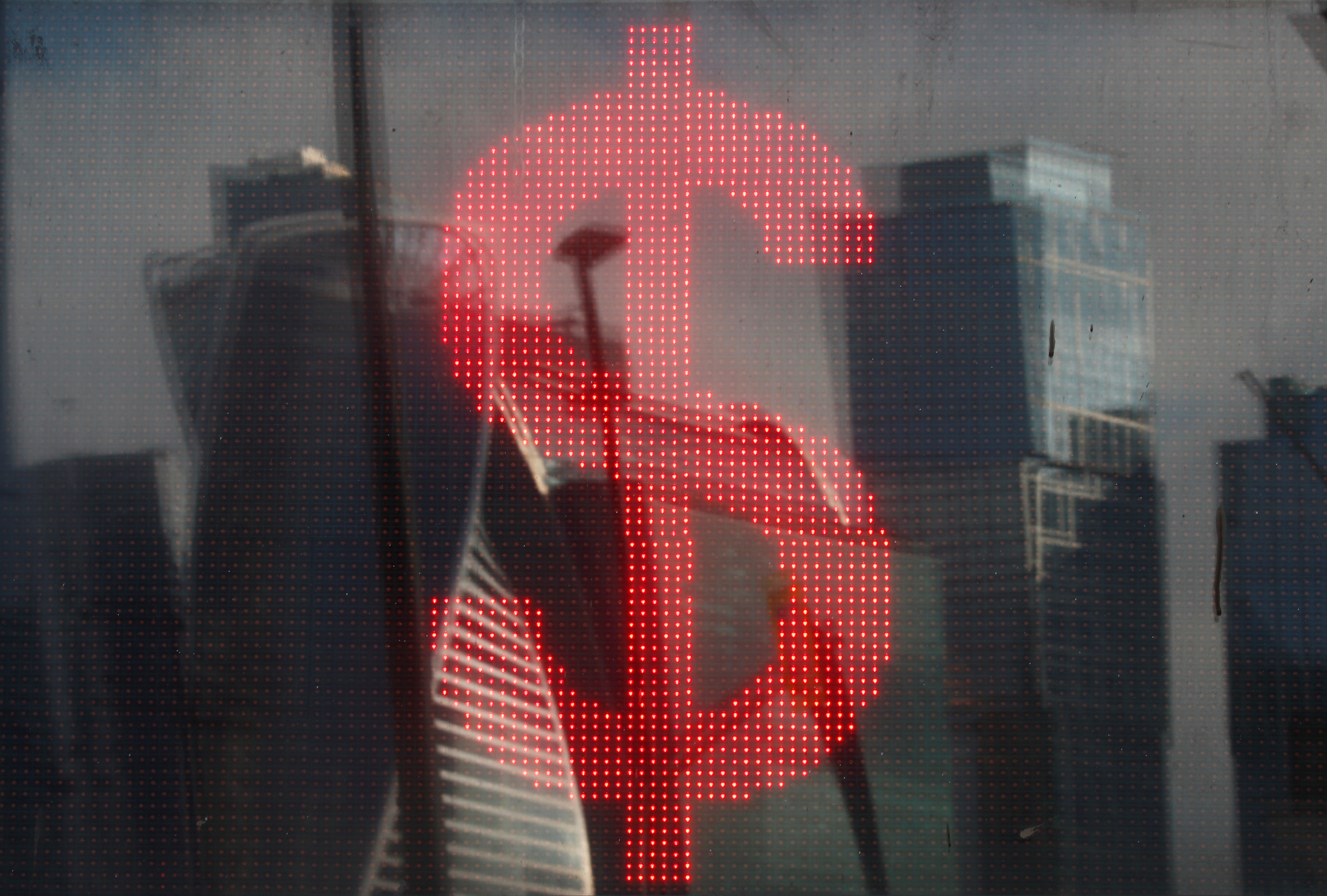 The U.S. dollar sign is seen on a board at a currency exchange office in Moscow