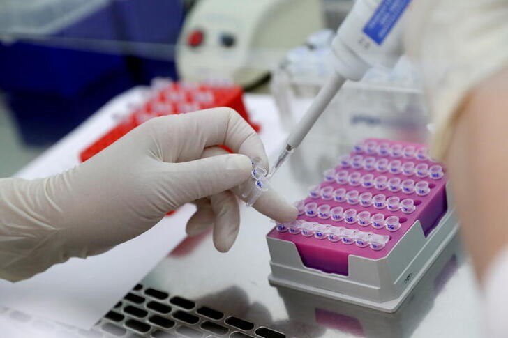 A biologist works on DNA extracted from cancer tissue in Oncompass Medicine's laboratory in Budapest