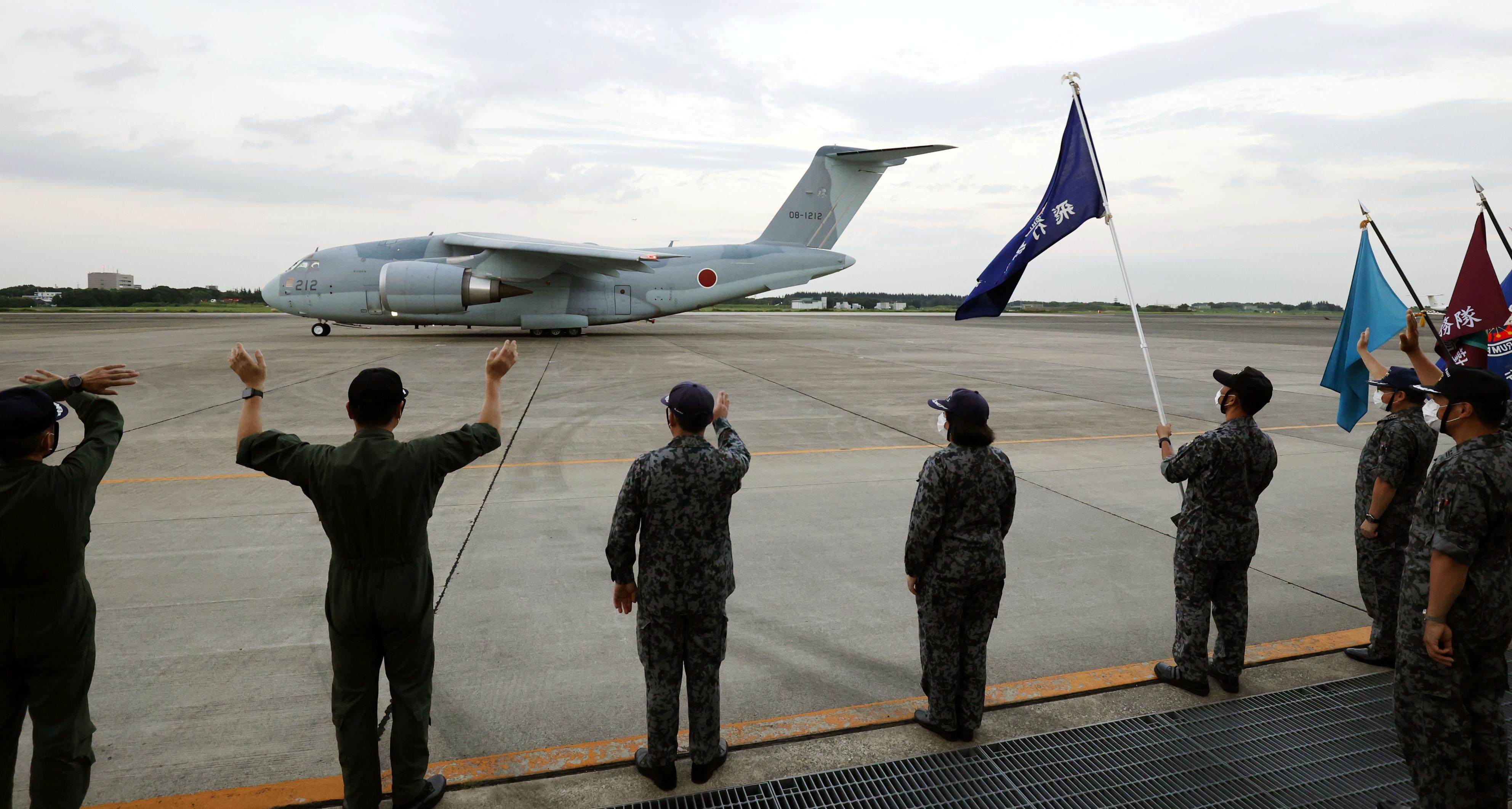 Japan Air Self-Defense Forces C-2 transport plane prepares to take off to Afghanistan from JASDF Iruma air base in Sayama, Japan