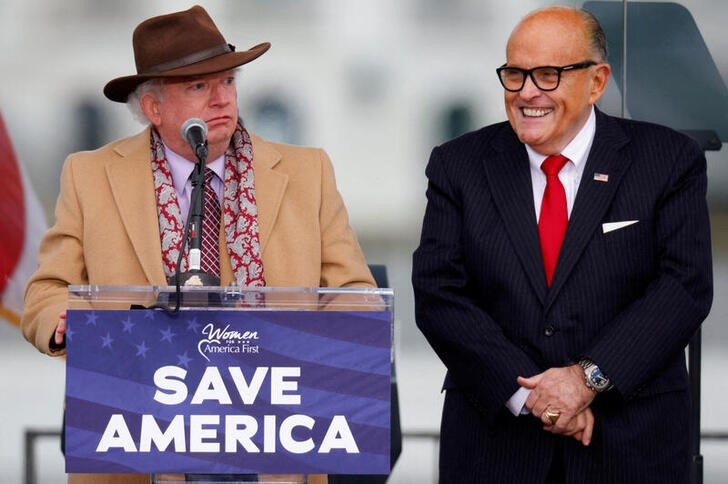 Attorney John Eastman gestures as he speaks next to U.S. President Donald Trump's personal attorney Rudy Giuliani at the January 6 Trump rally on the Ellipse in Washington