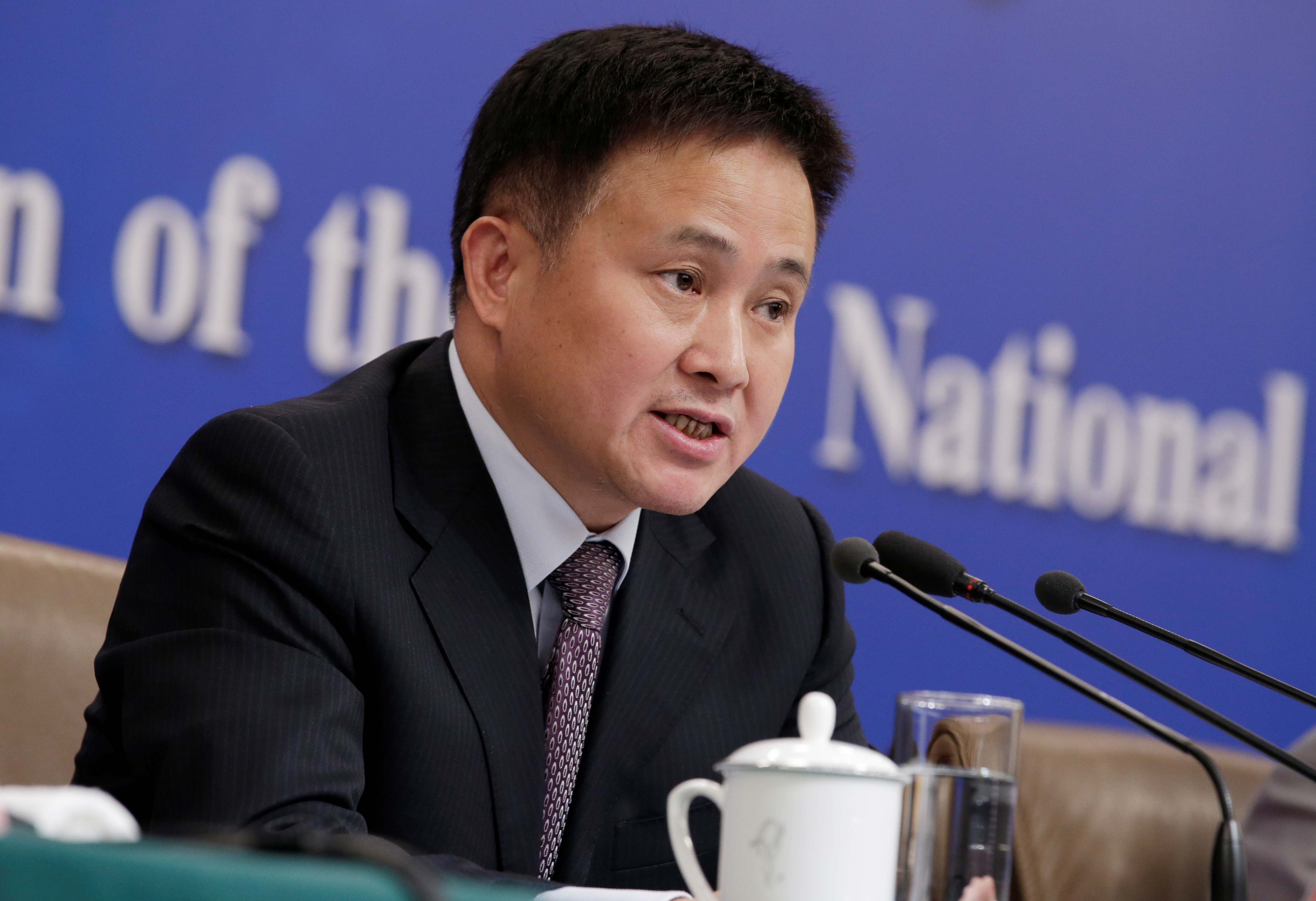Pan Gongsheng, vice governor of the PBOC, attends a news conference during ongoing session of the NPC in Beijing