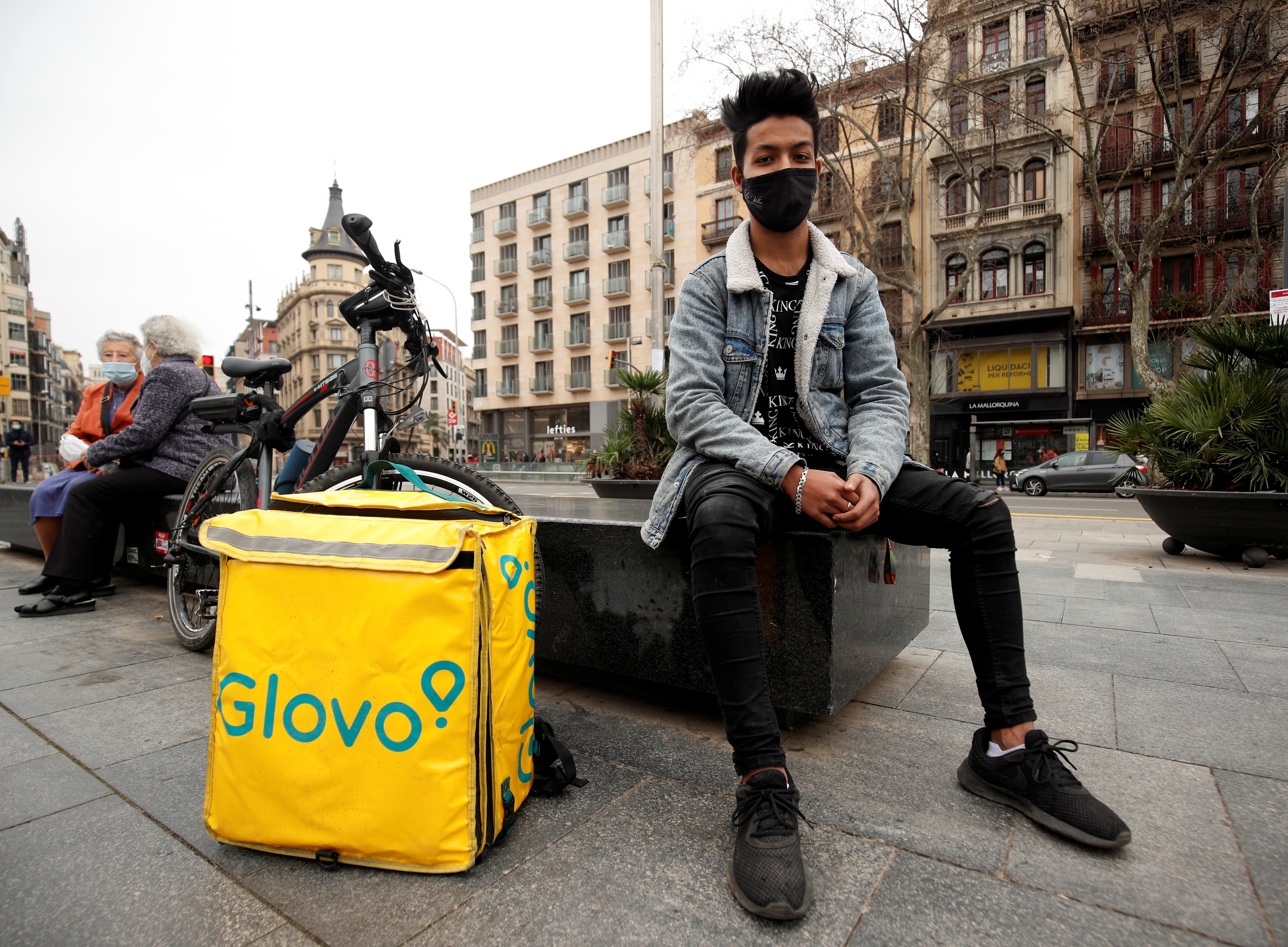 Delivery rider Manzurul Hoque from Bangladesh poses during an interview at Universitat square in Barcelona