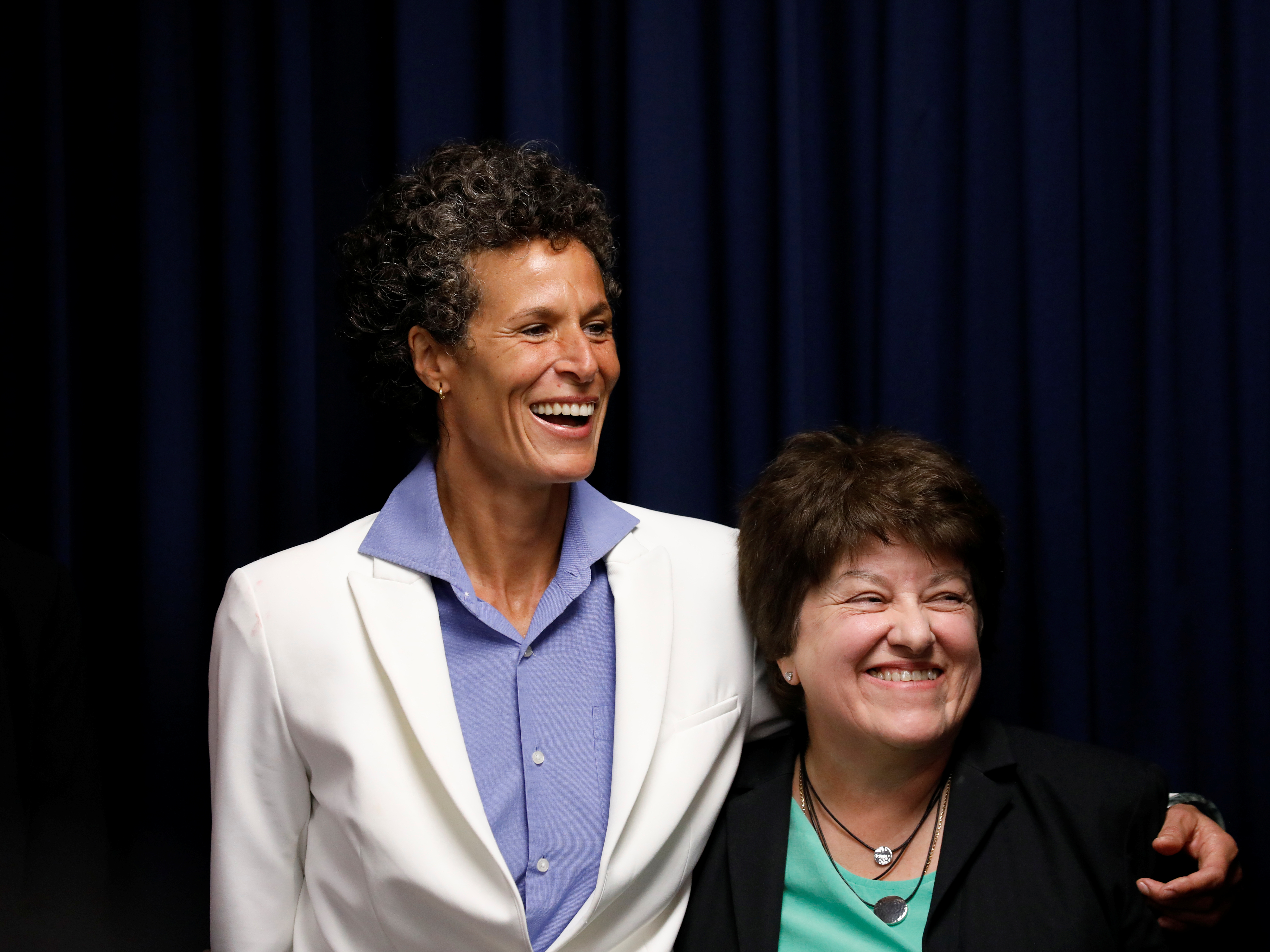Bill Cosby accuser Andrea Constand embraces lawyer Dolores Troiani during a news conference after a jury convicted actor and comedian Bill Cosby for sexual assault during a retrial in Norristown, Pennsylvania, U.S., April 26, 2018. REUTERS/Brendan McDermid