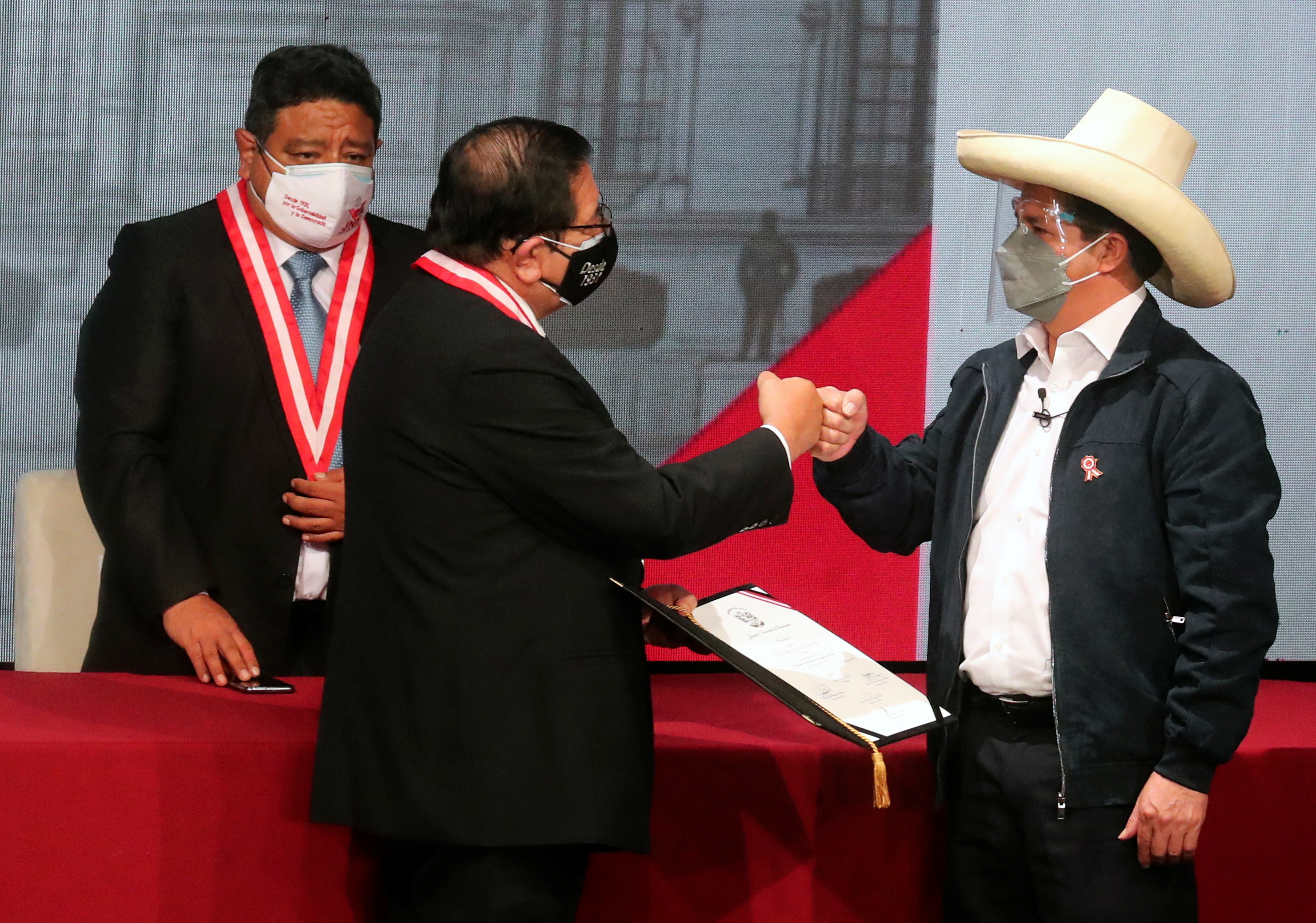 Peruvian President-elect Pedro Castillo receives credentials from election authority after being declared winner of Peru's presidential election, in Lima, Peru, July 23, 2021. REUTERS/Sebastian Castaneda/Pool