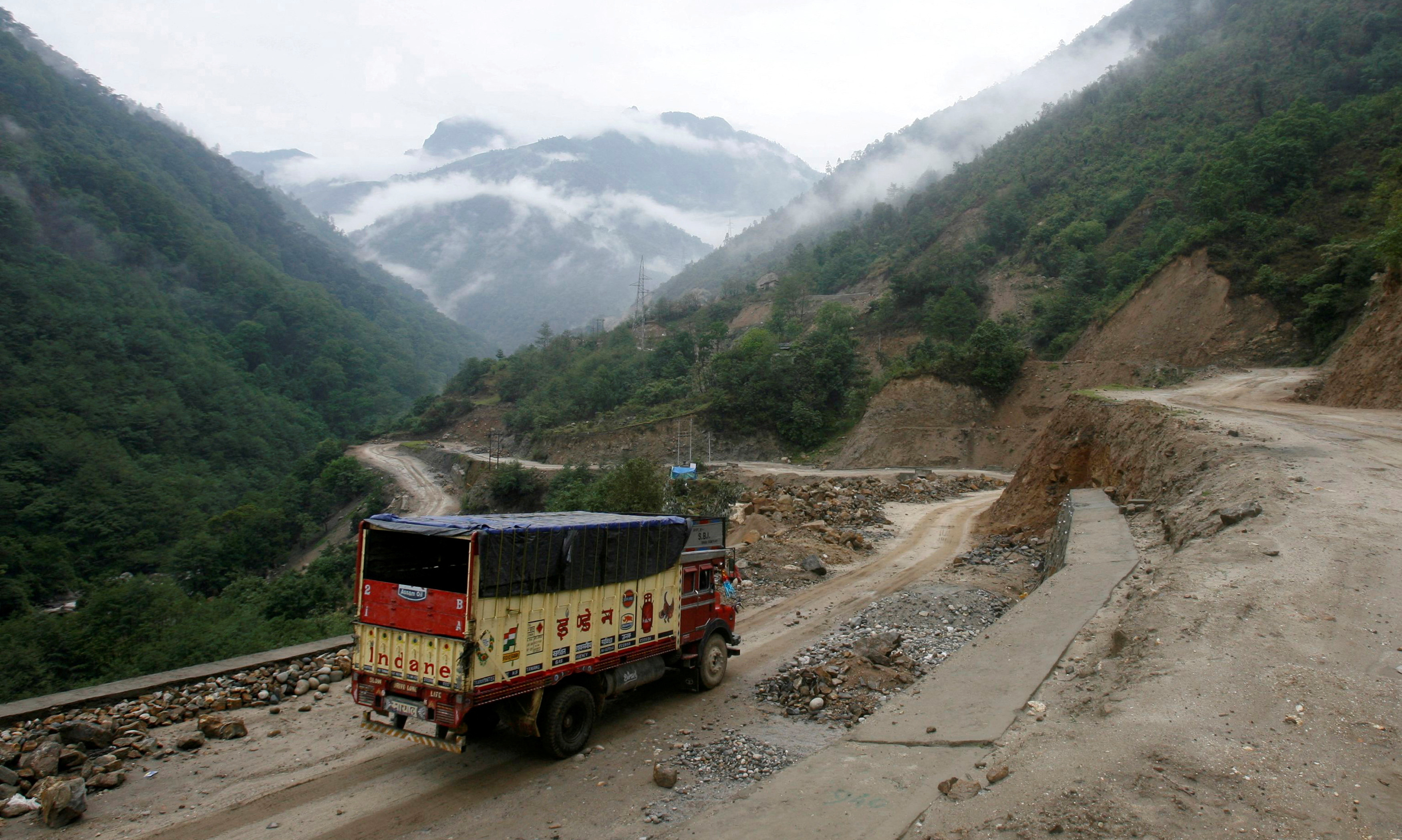 A liquefied petroleum gas delivery truck drives along India's Tezpur-Tawang highway which runs to the Chinese border, in the northeastern Indian state of Arunachal Pradesh