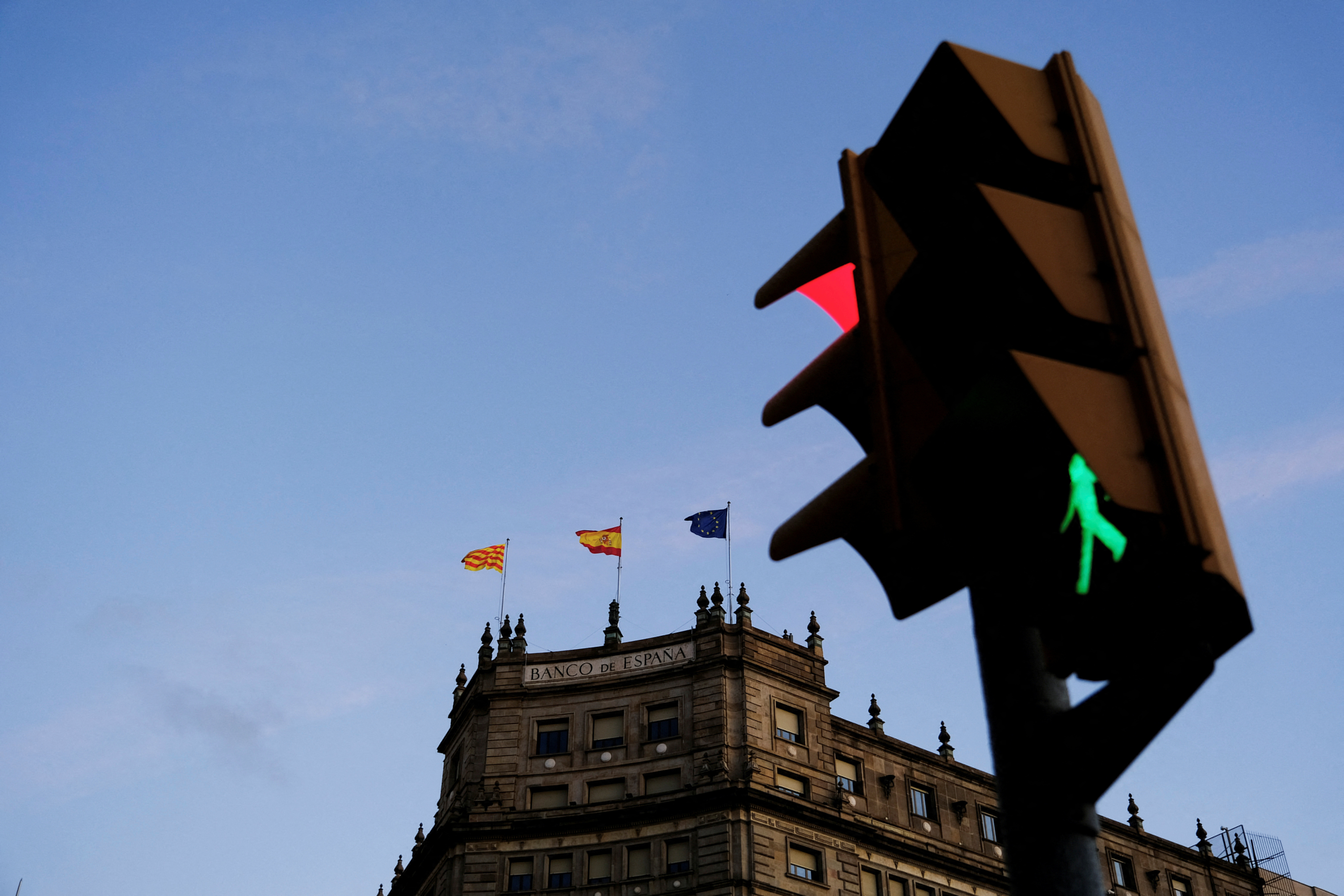 The Banco de Espana (Bank of Spain) office is seen in front of a traffic light in Barcelona