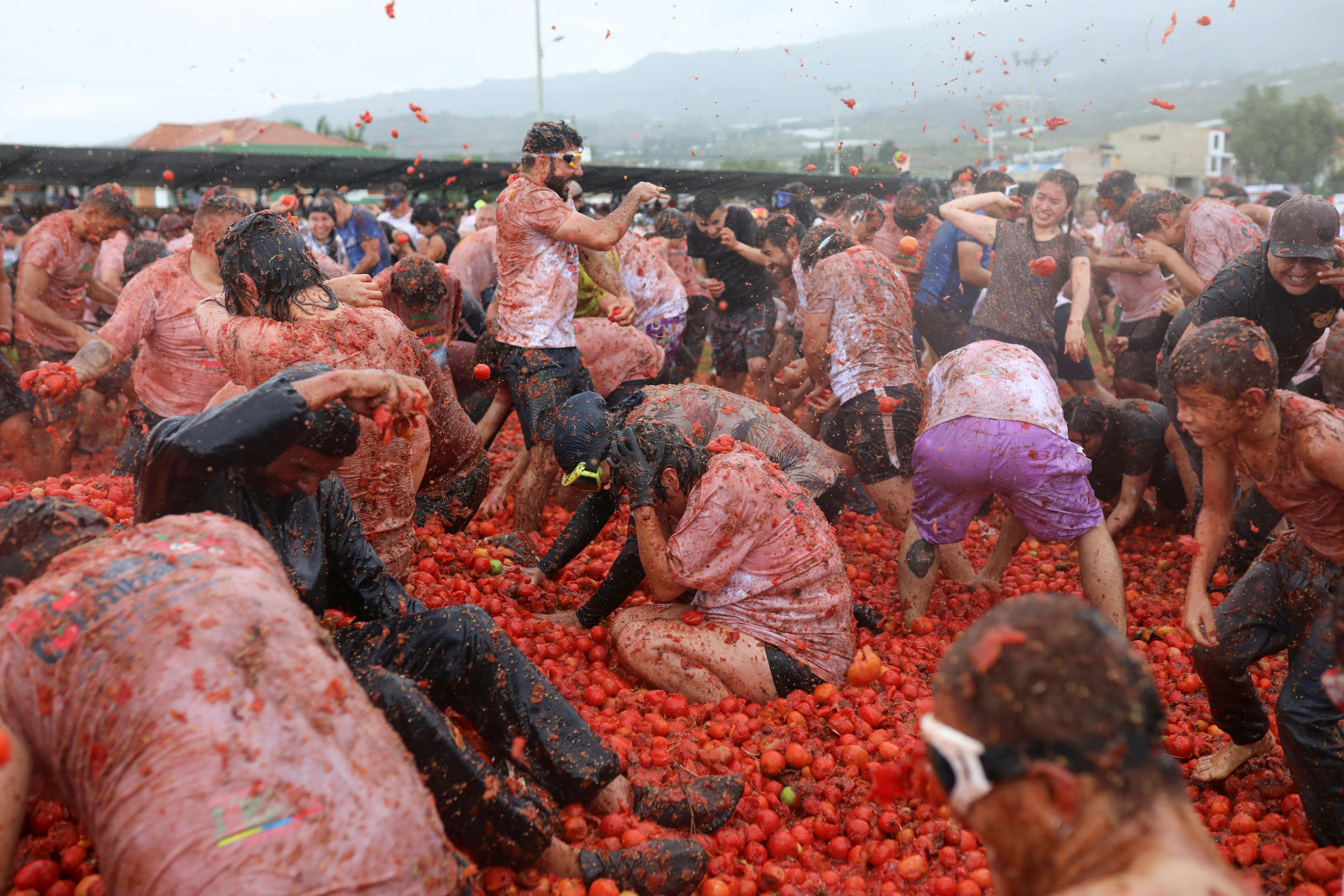 Tomatoes fly during Colombia's Gran Tomatina festival - June 2