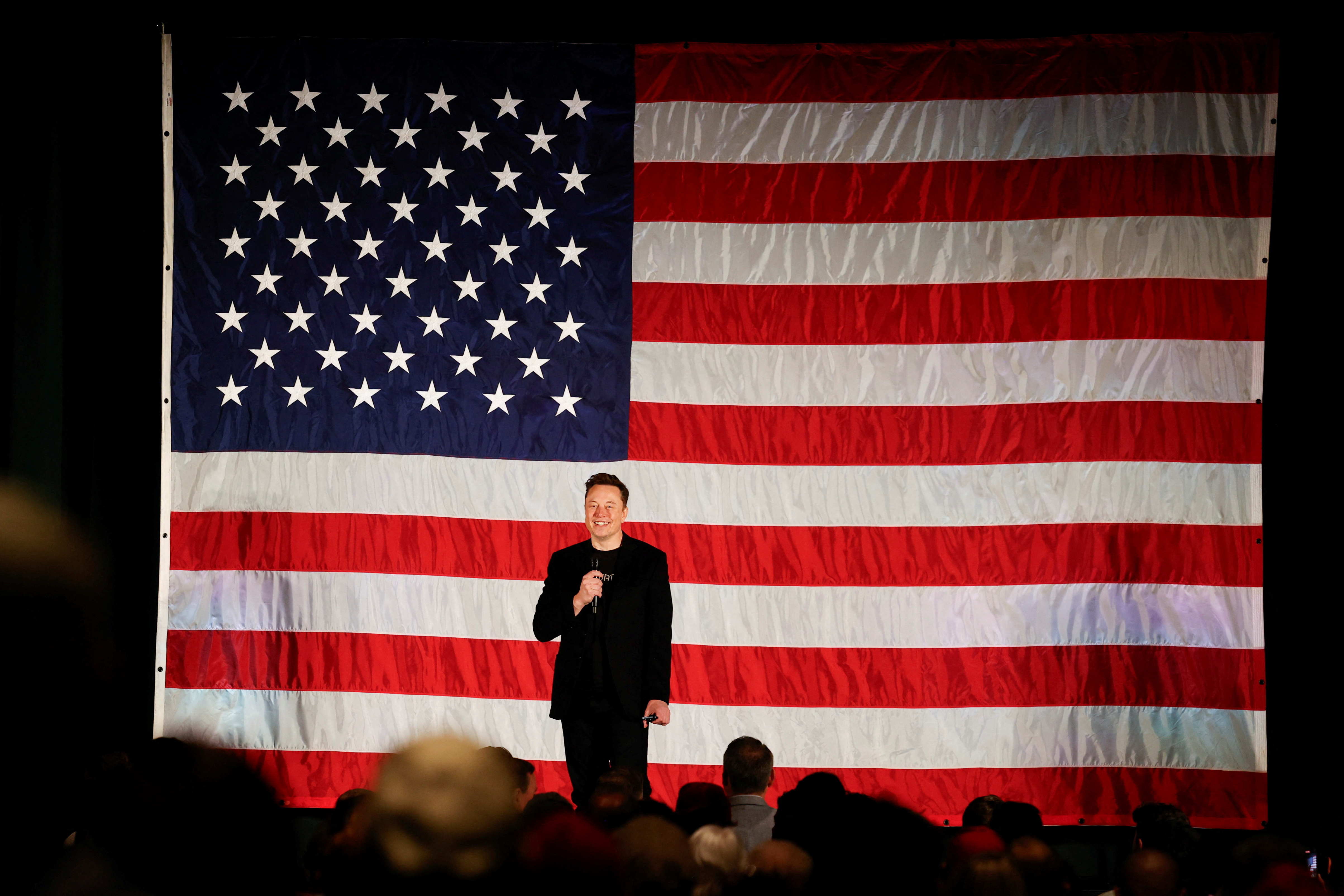 Tesla CEO and X owner Elon Musk speaks about voting during an America PAC Town Hall, in Folsom