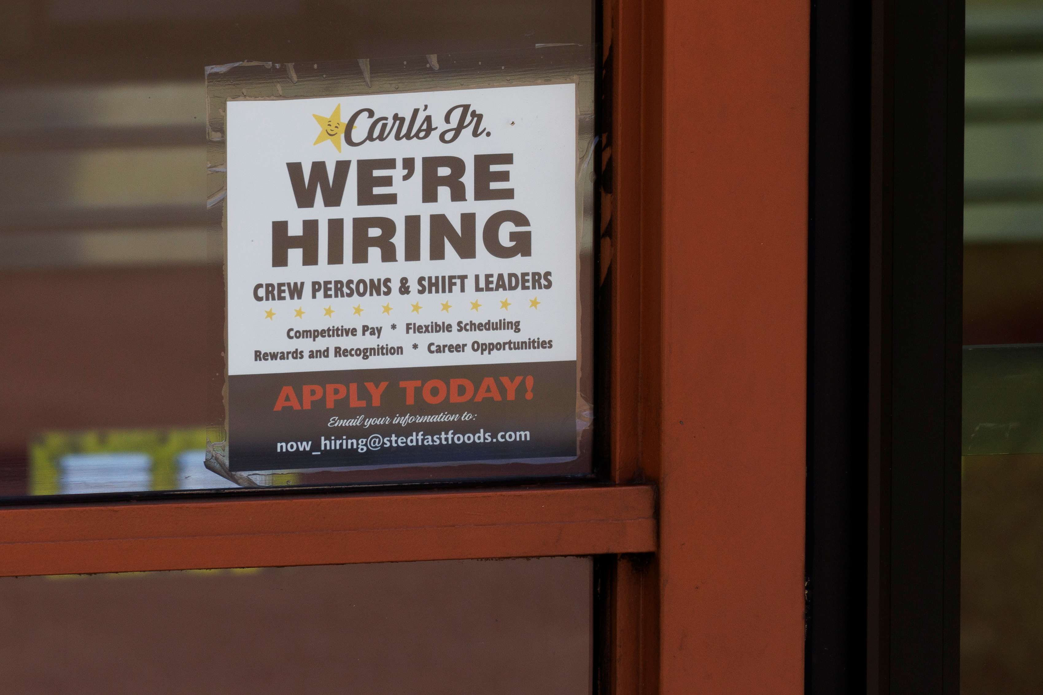 A help wanted sign is shown at a fast food restaurant in Solana Beach, California