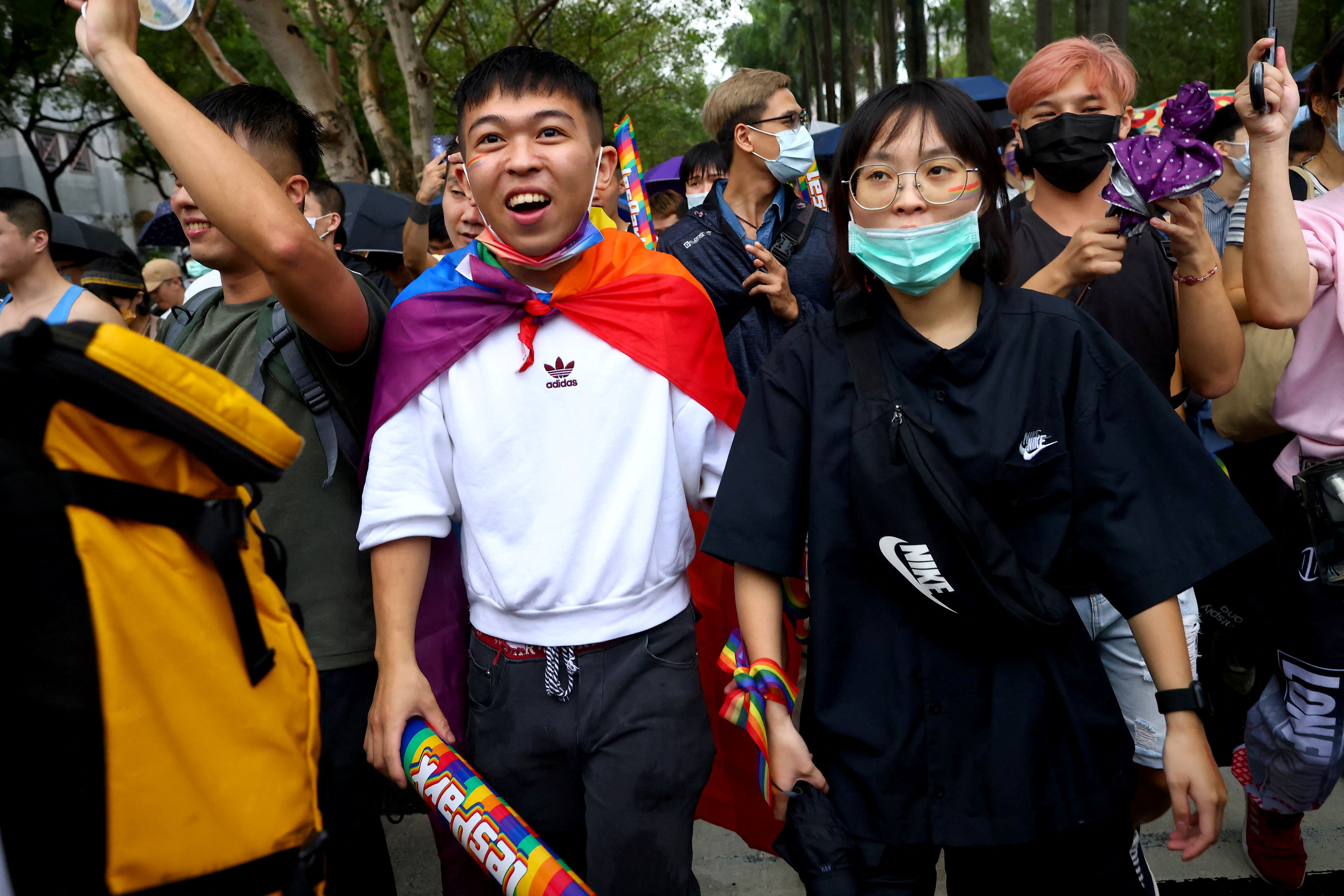 People with rainbows painted on their faces join the annual pride parade in Taipei