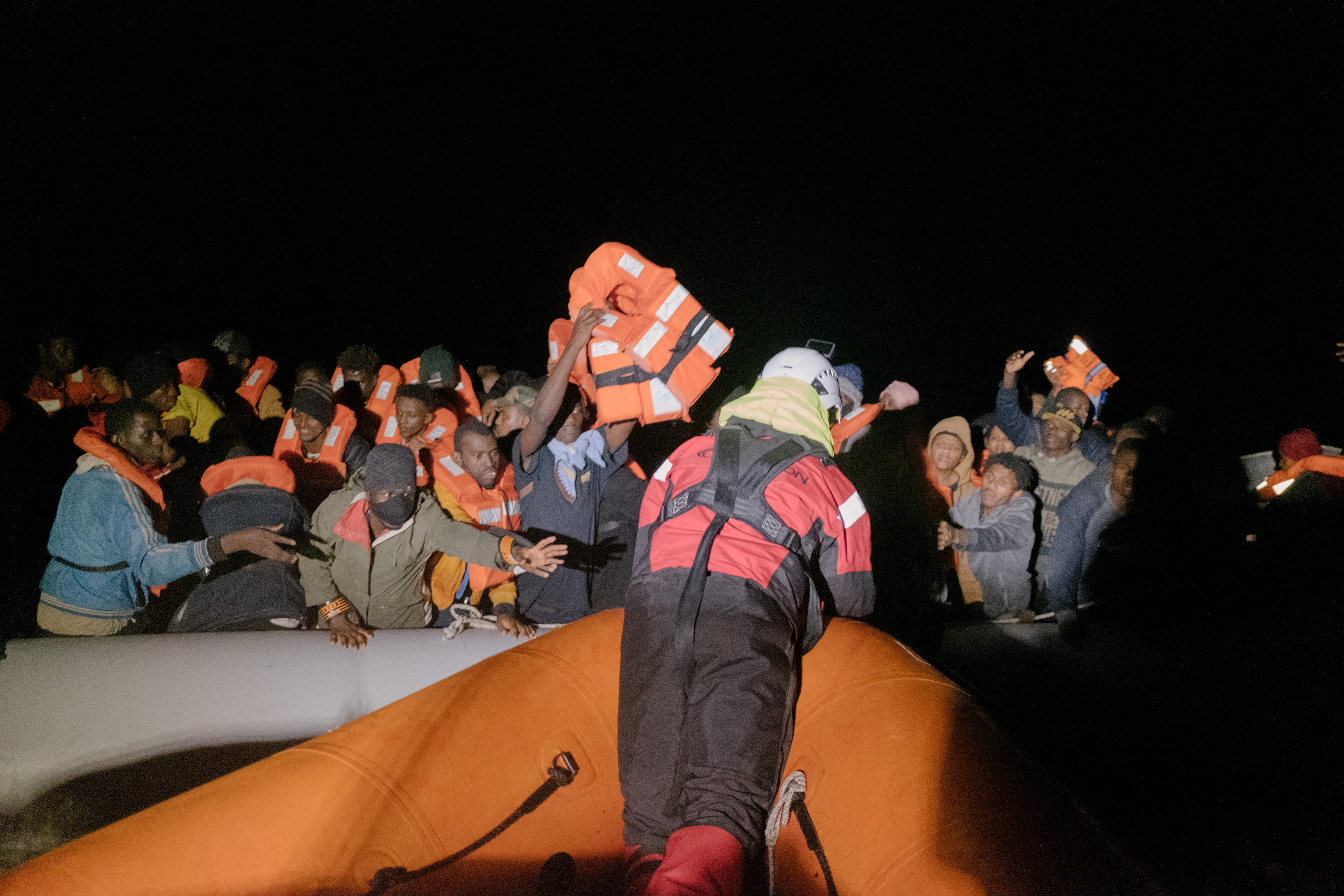 Migrants are rescued by members of the German NGO Sea-Watch during a search and rescue (SAR) operation in the Mediterranean Sea on Christmas day, December 25, 2021.  Max Brugger/Sea Watch/Handout via REUTERS  