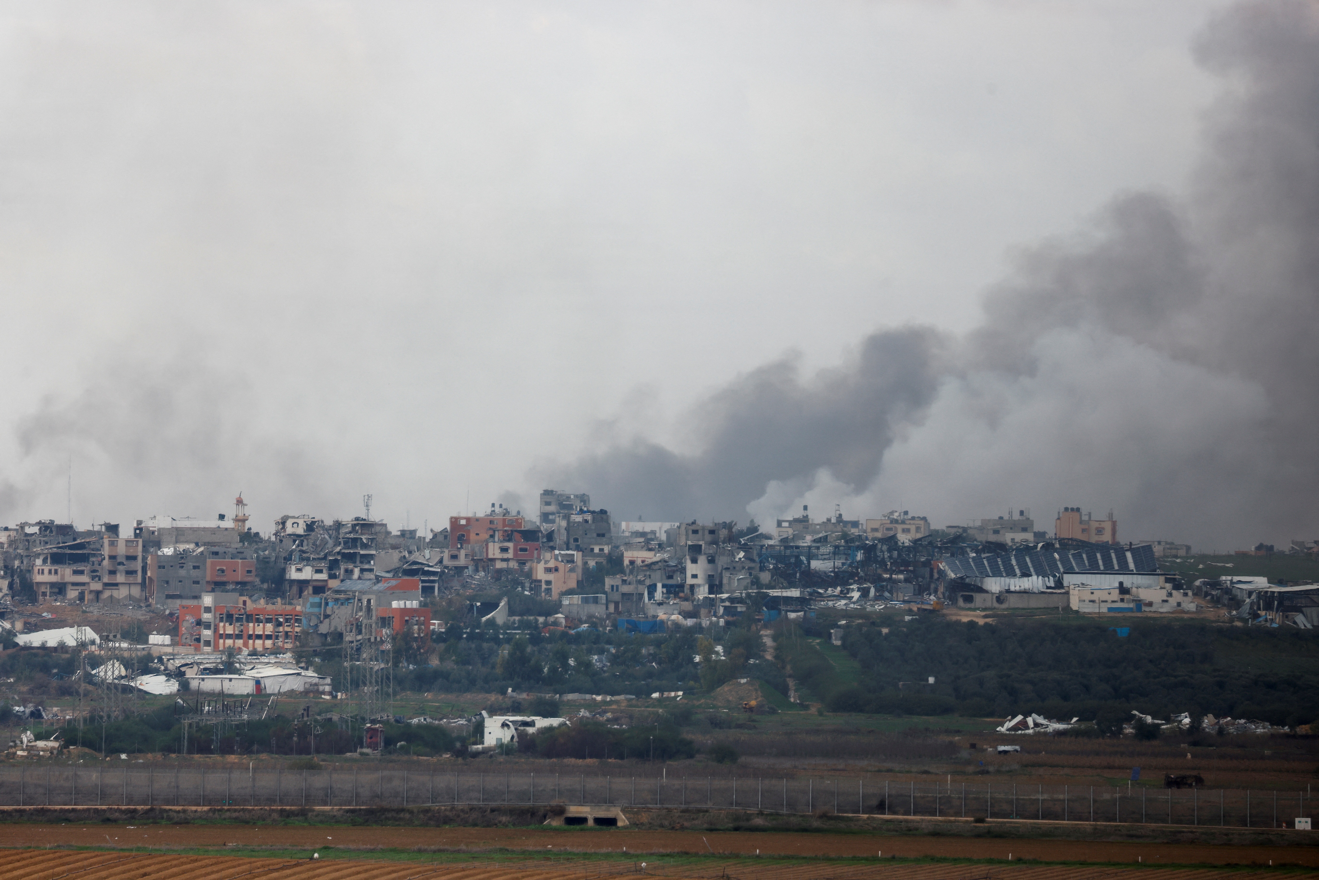 Smoke rises over the Gaza, as seen from Israel