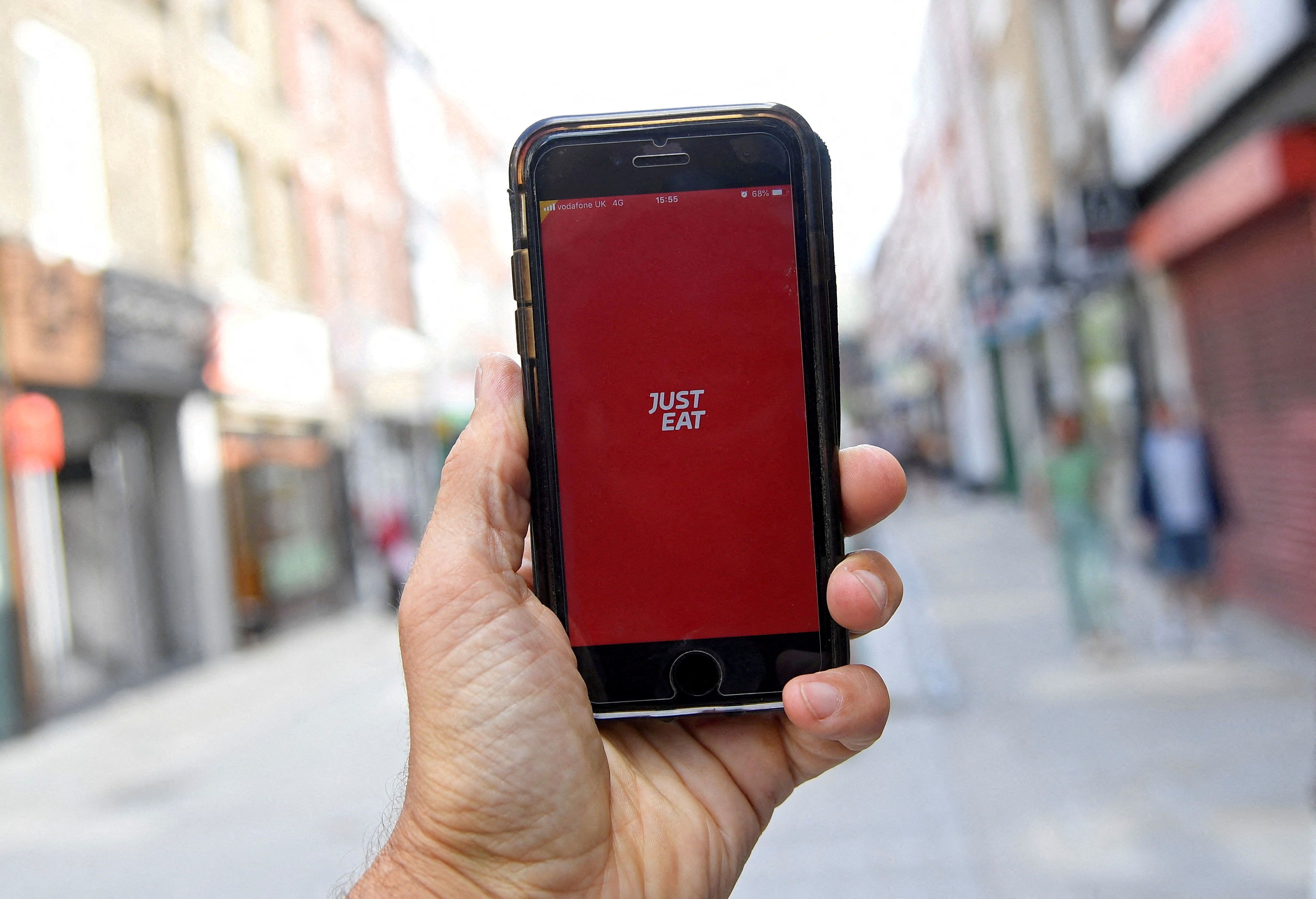 The app for Just Eat is displayed on a smartphone in London