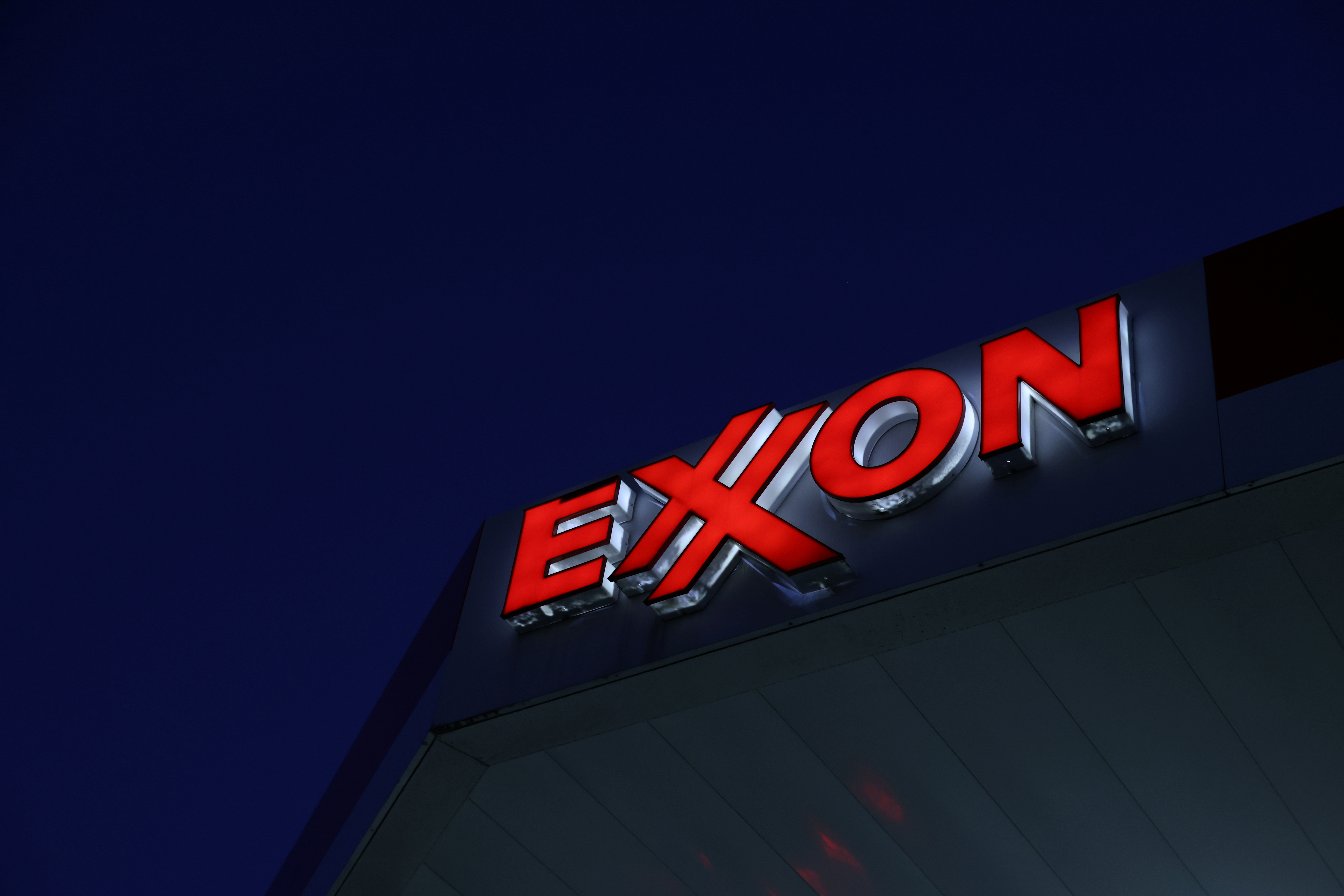 Signage is seen at an Exxon gas station in Brooklyn, New York City