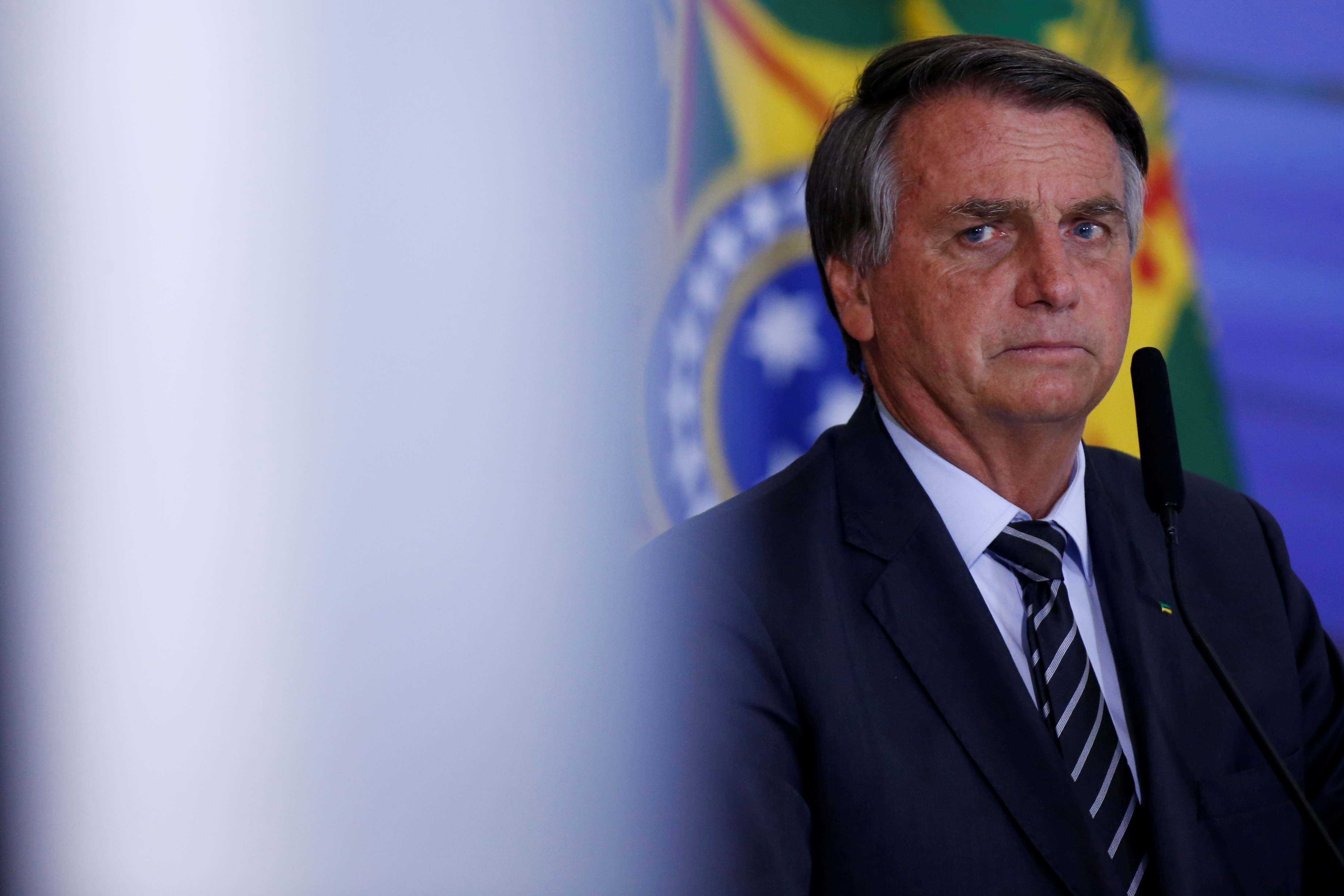 Brazil's President Bolsonaro looks on during a ceremony in Brasilia