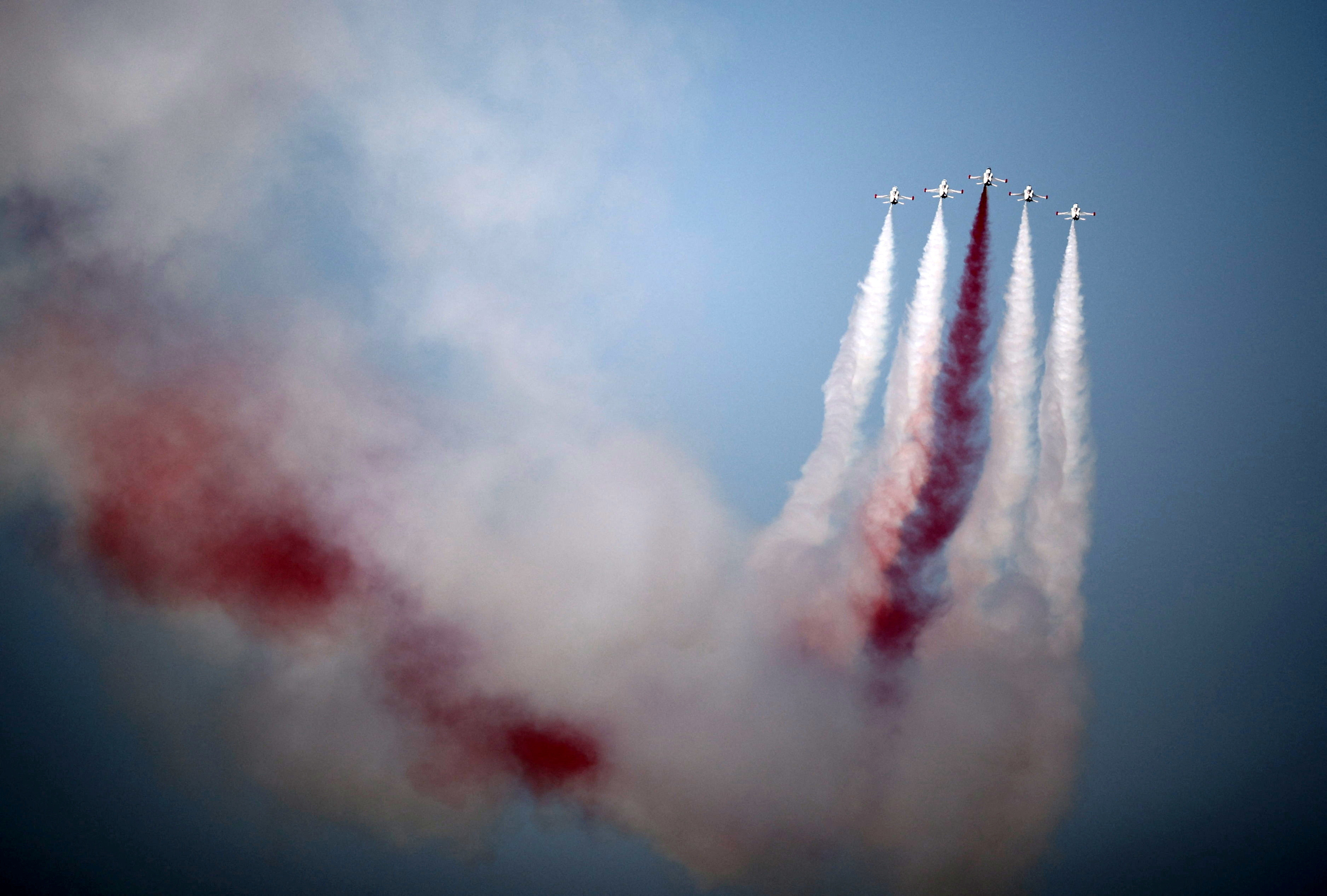 Turkish acrobatic aircrafts fly over a military parade to mark the 1974 Turkish invasion of Cyprus in response to a short-lived Greek-inspired coup, in the Turkish-controlled northern Cyprus, in the divided city of Nicosia