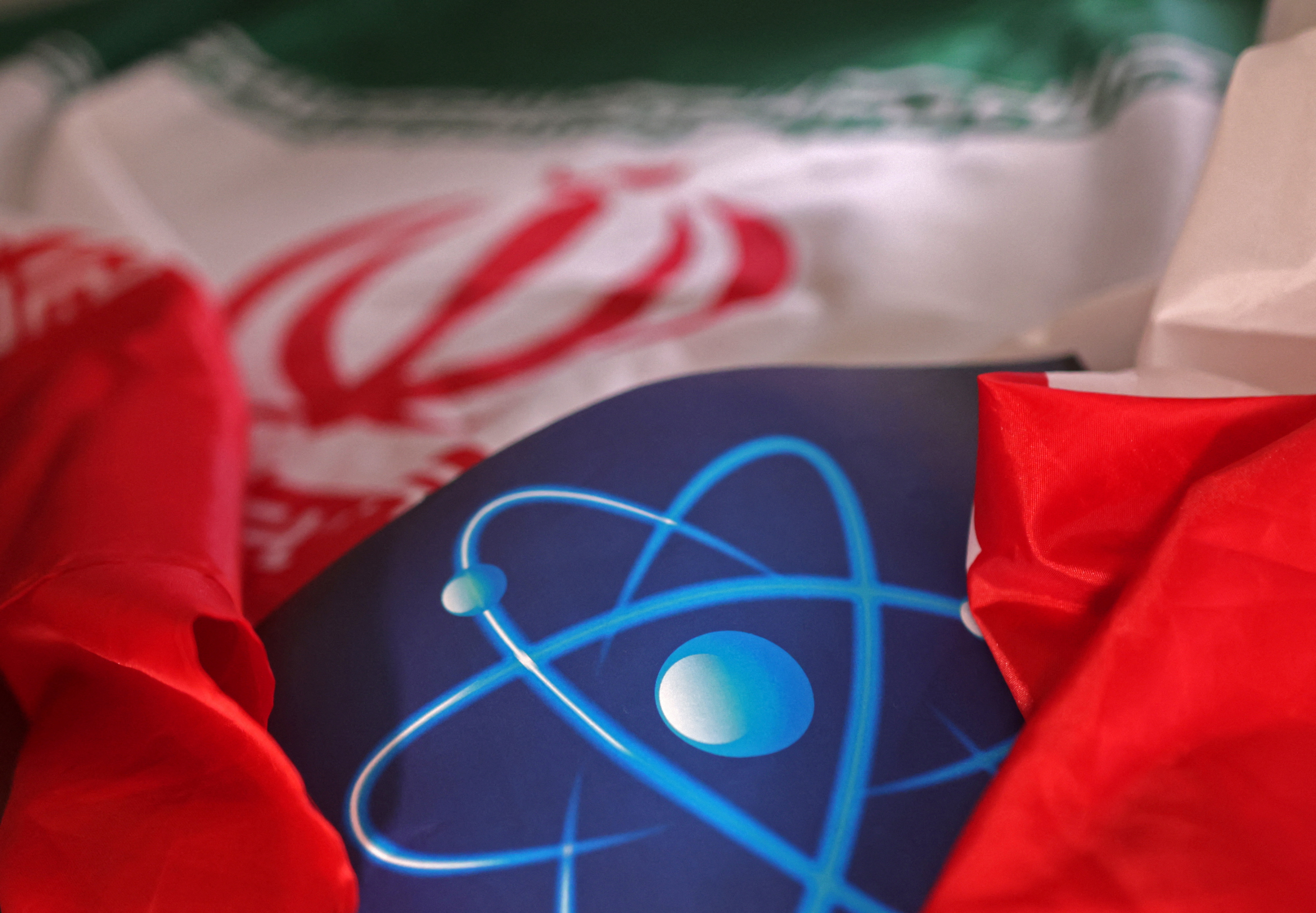 Illustration shows atomic symbol and Iranian flag
