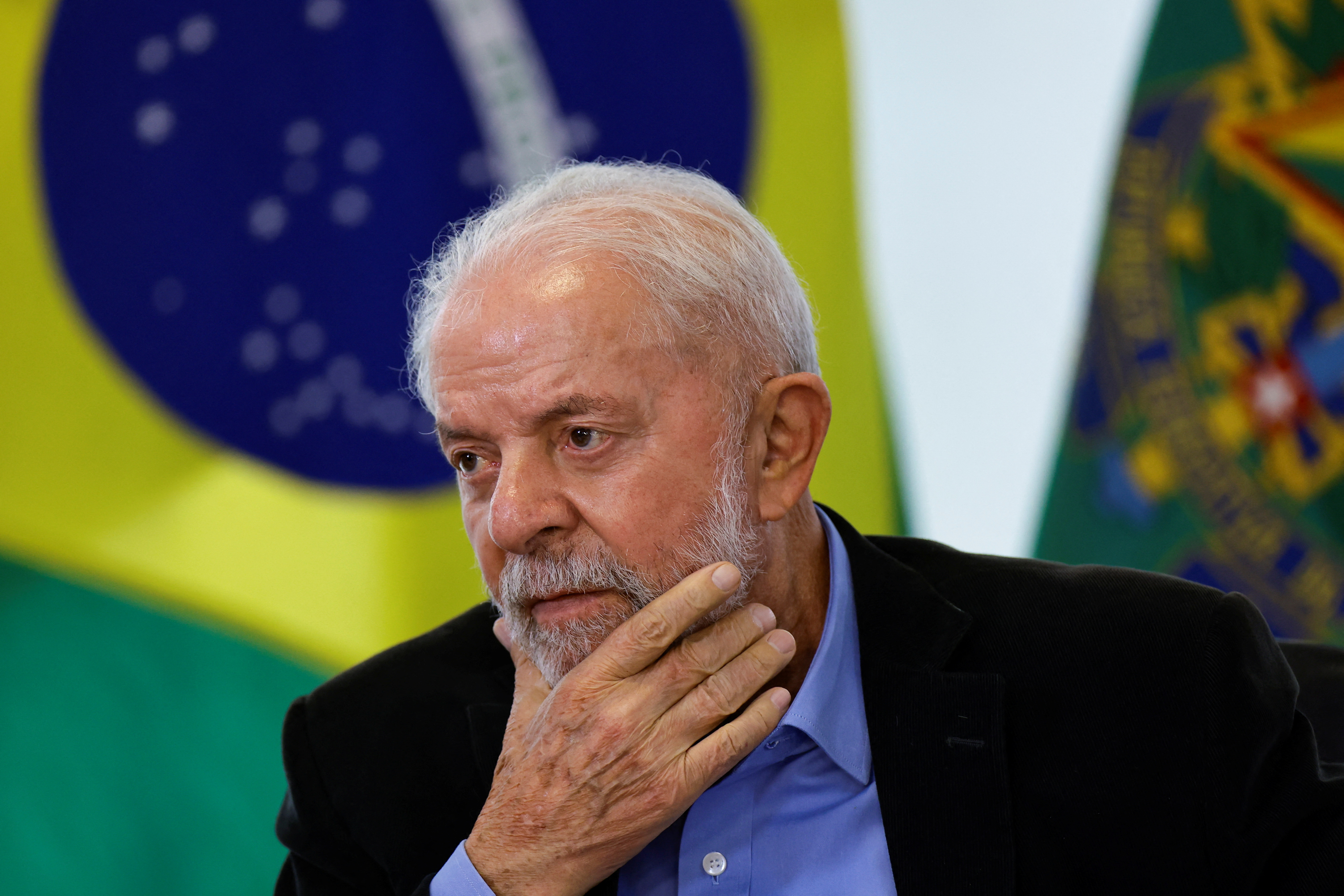 Brazil’s President Luiz Inacio Lula da Silva reacts during a meeting with members of the automotive sector in Brasilia