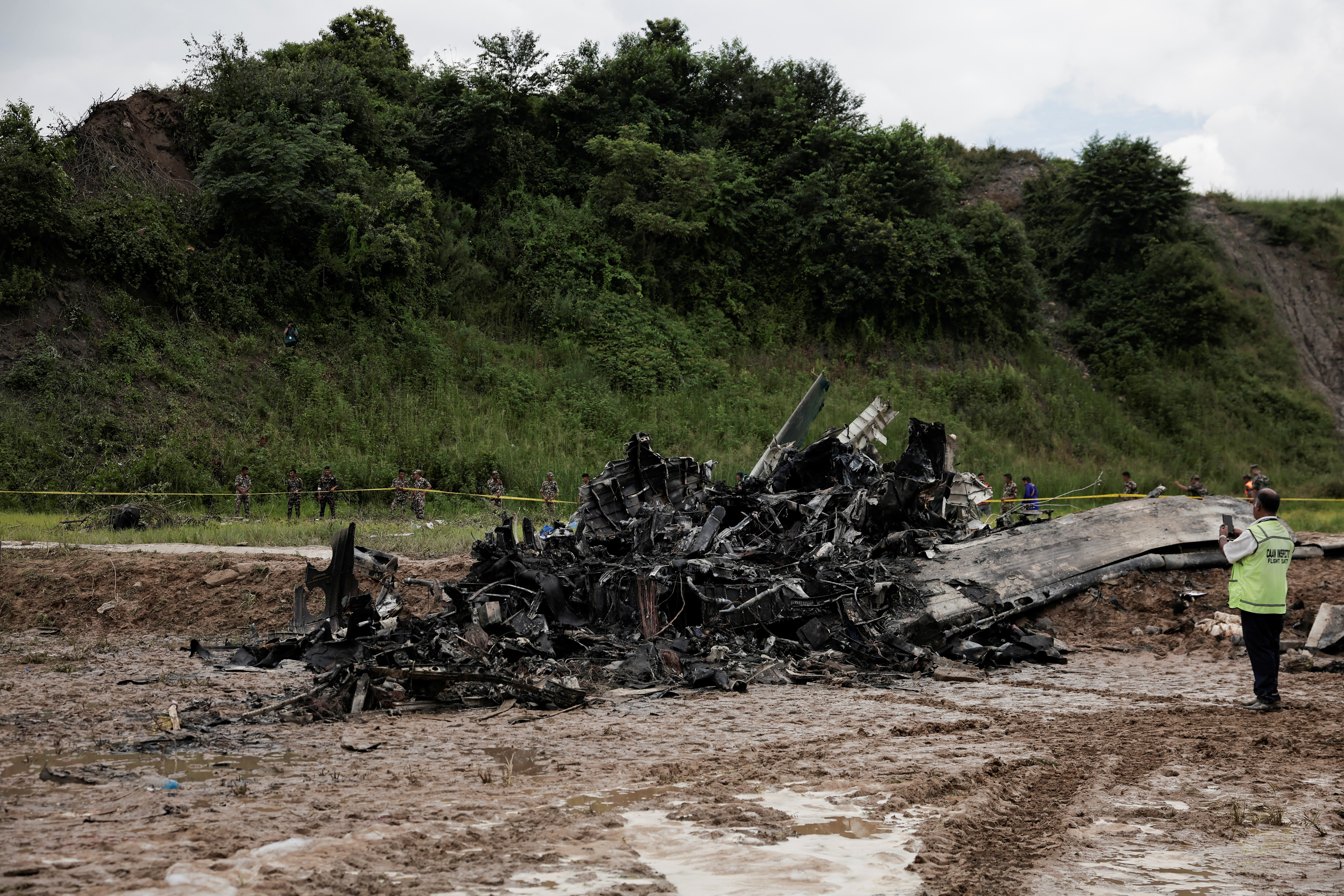 Burnt wreckage of crashed aircraft, in Kathmandu