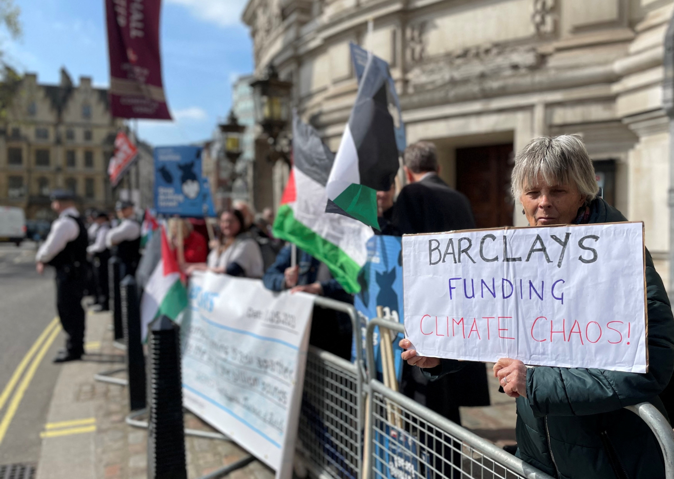 Climate activists protest outside Barclays' Annual General Meeting in London