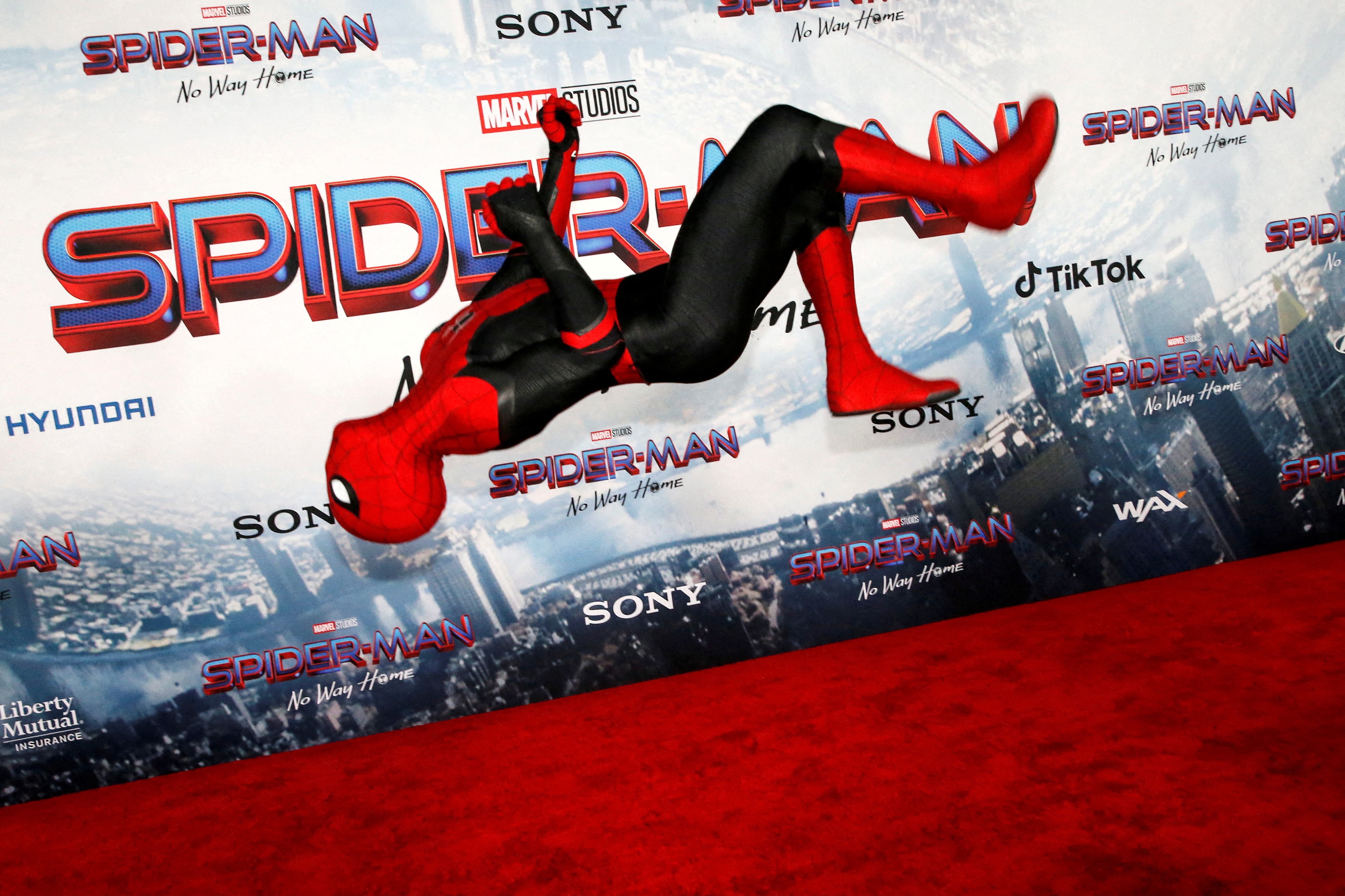 A person dressed in Spider-Man costume performs at the premiere for the film Spider-Man: No Way Home in Los Angeles, California, December 13, 2021. REUTERS/Mario Anzuoni