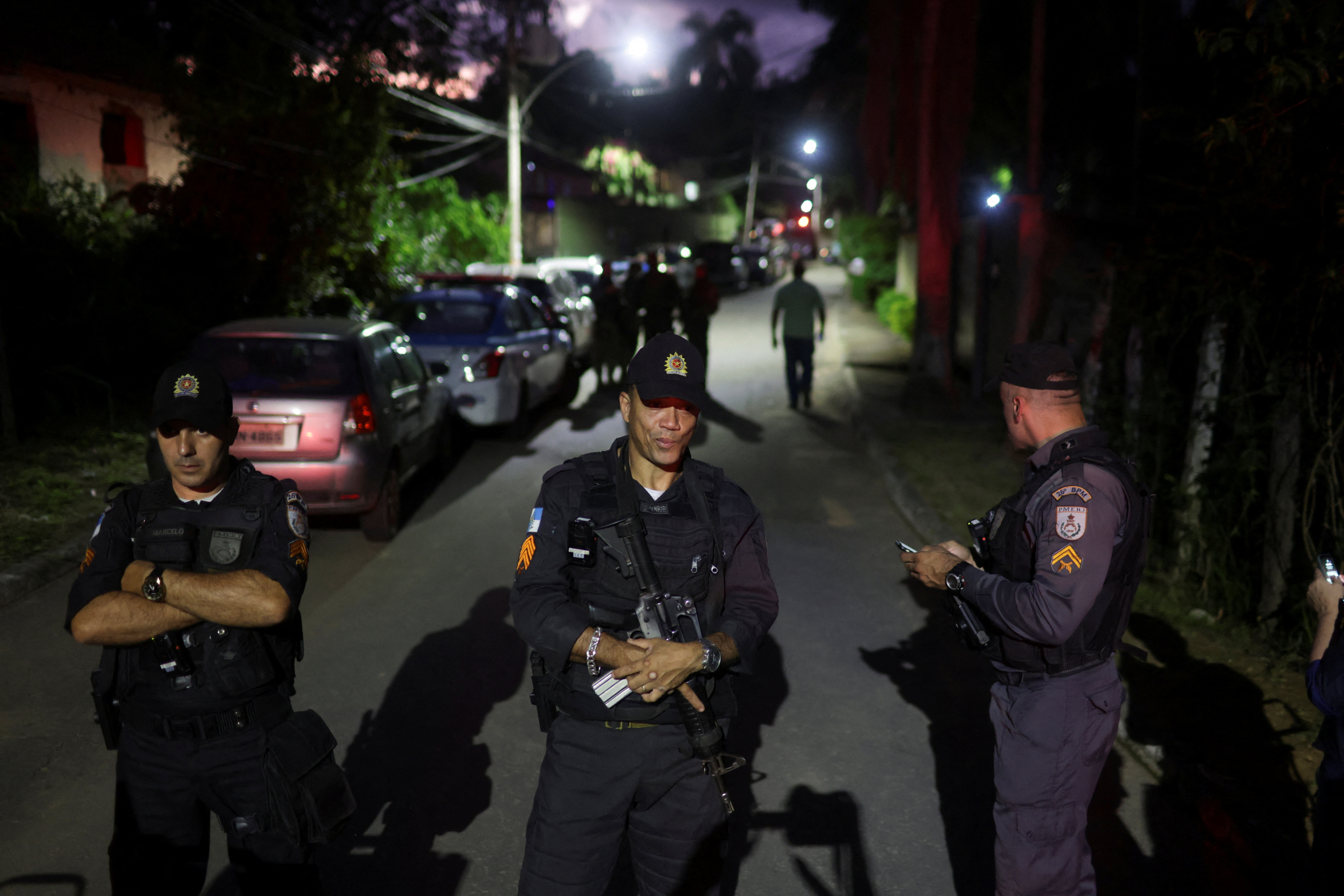 Police officers block a street as supporters of Brazilian politician Roberto Jefferson demonstrate close to his house in Comendador Levy Gasparian