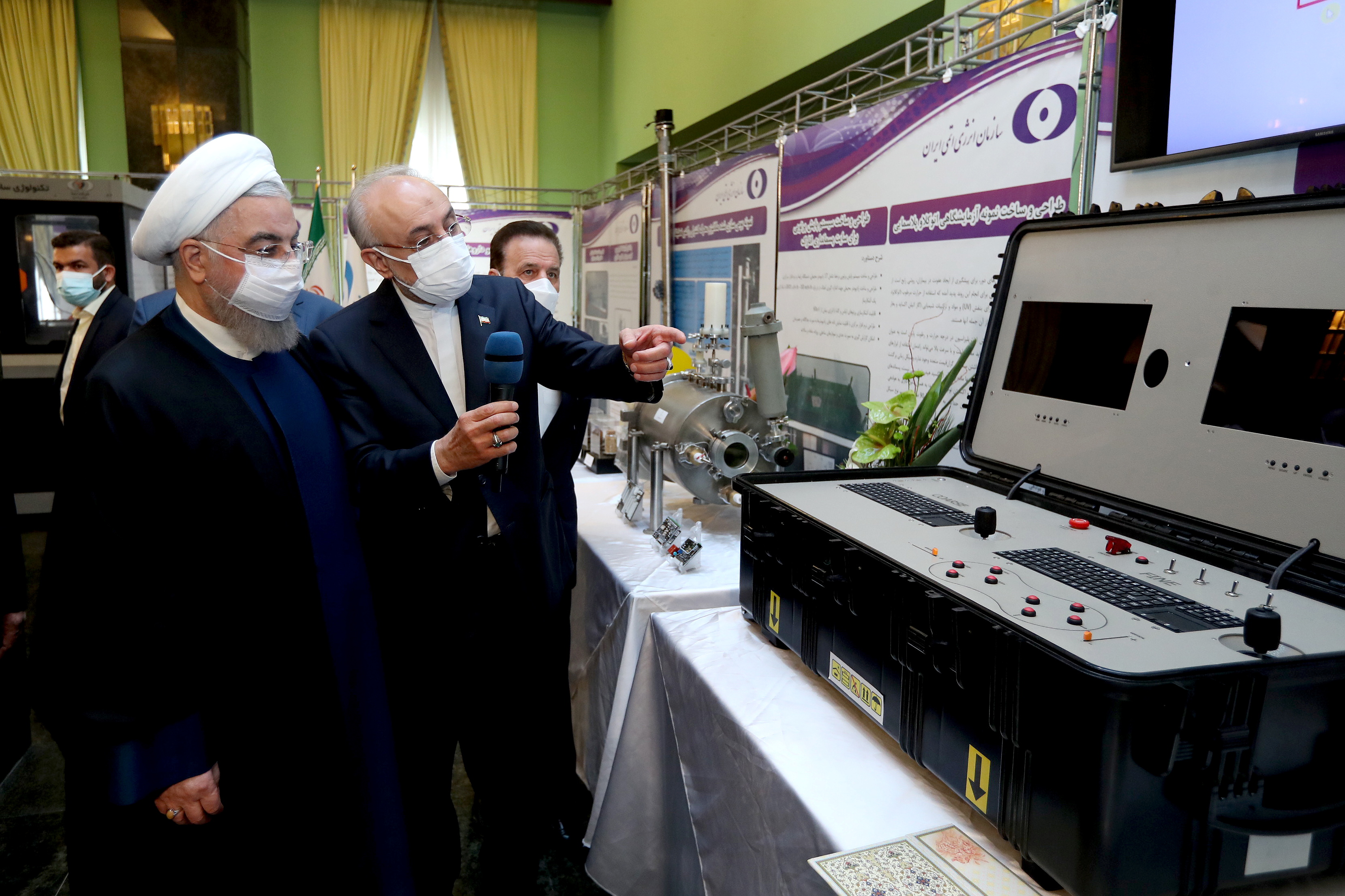 Iranian President Hassan Rouhani reviews Iran's new nuclear achievements during Iran's National Nuclear Energy Day in Tehran