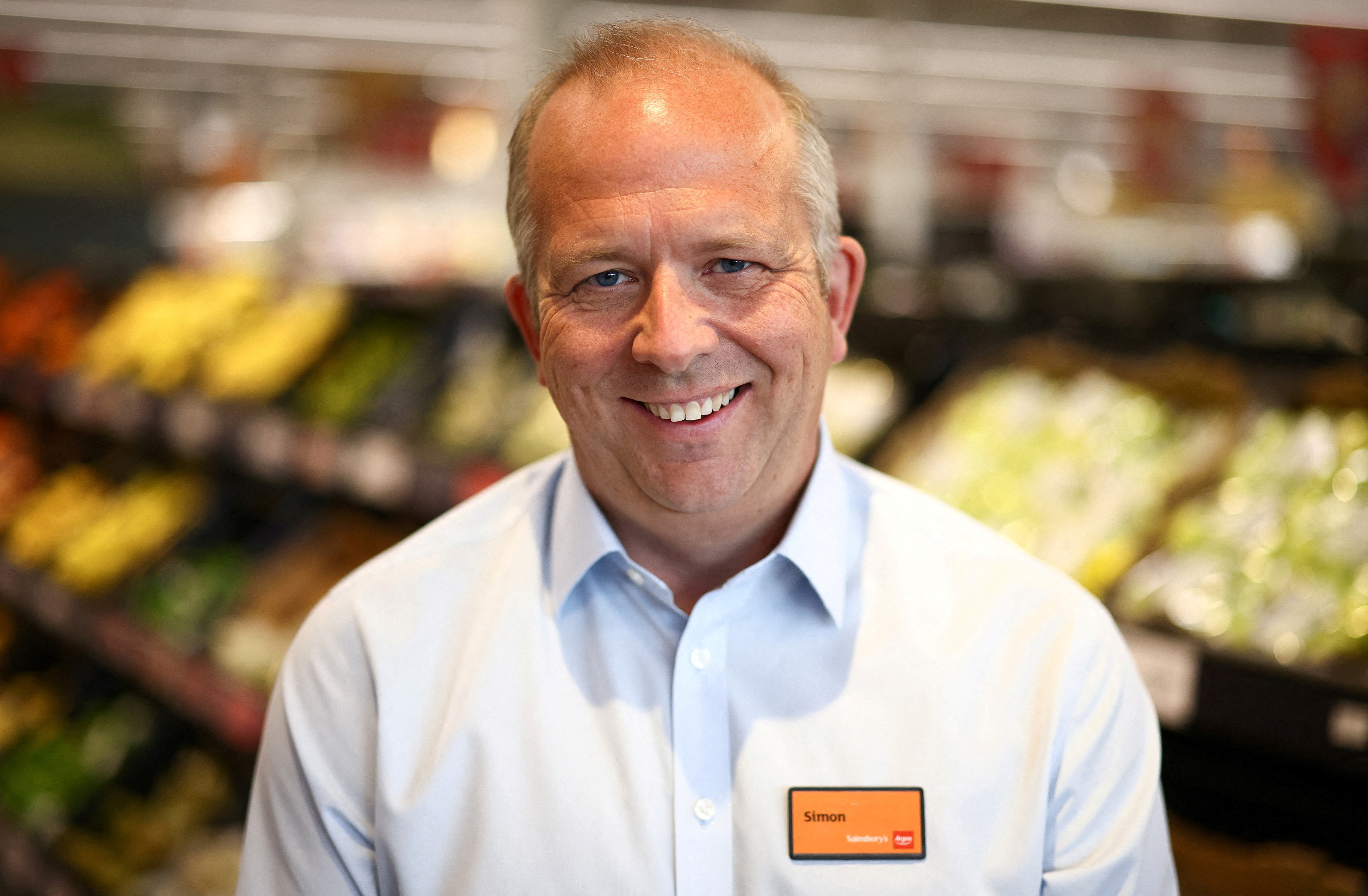 Chief Executive Officer of Sainsbury's Simon Roberts poses inside a Sainsbury’s  supermarket in Richmond, west London