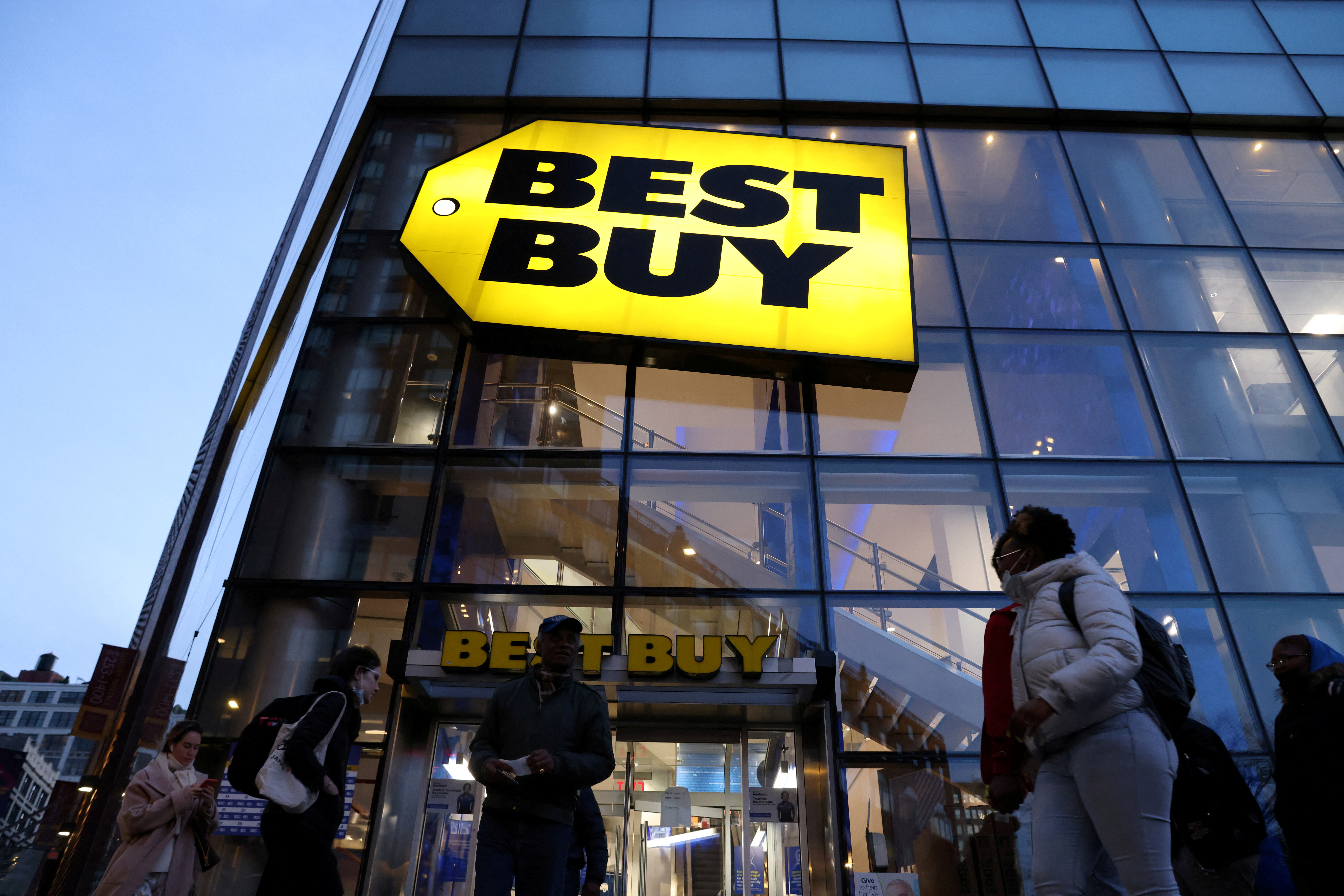 People walk past a Best Buy store in Manhattan, New York City