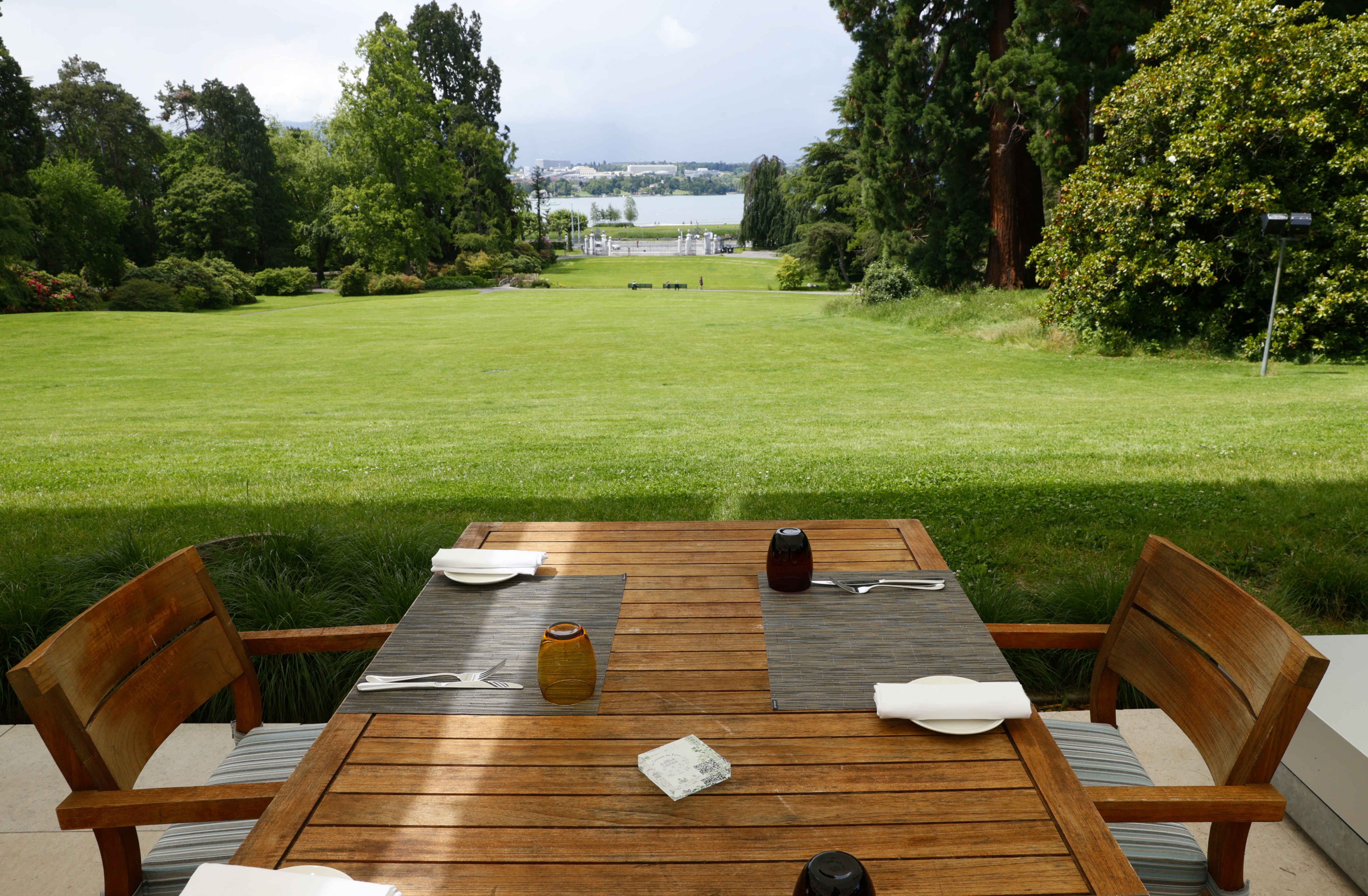 A table is set with a view to the United Nations and the Lake Leman in the Eaux-Vives Parc next to La Grange in Geneva, Switzerland, June 8, 2021. REUTERS/Denis Balibouse