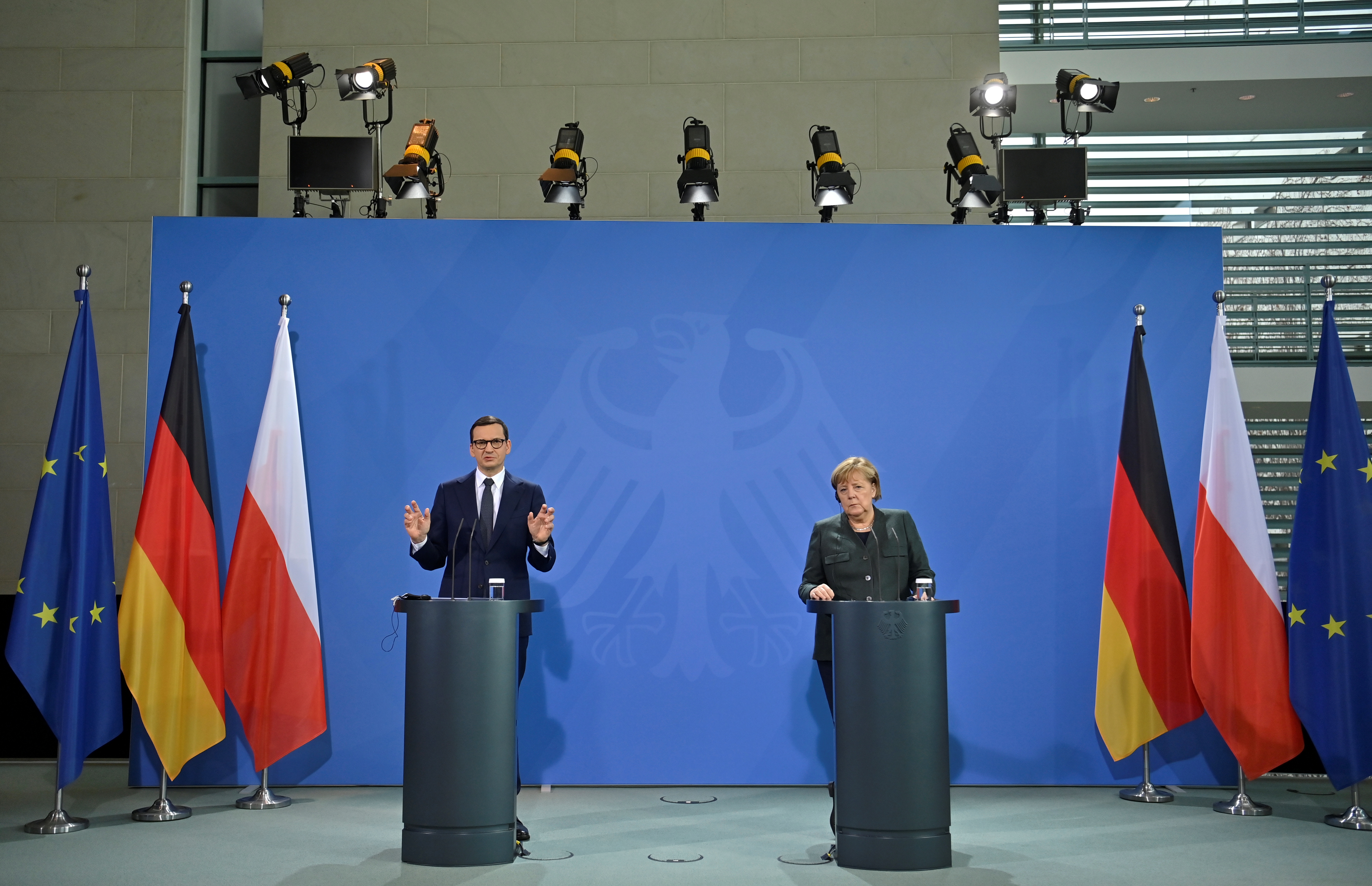German Chancellor Angela Merkel and Polish Prime Minister Mateusz Morawiecki speak to the media after talks in Berlin, Germany November 25, 2021. John MacDougall/Pool via REUTERS