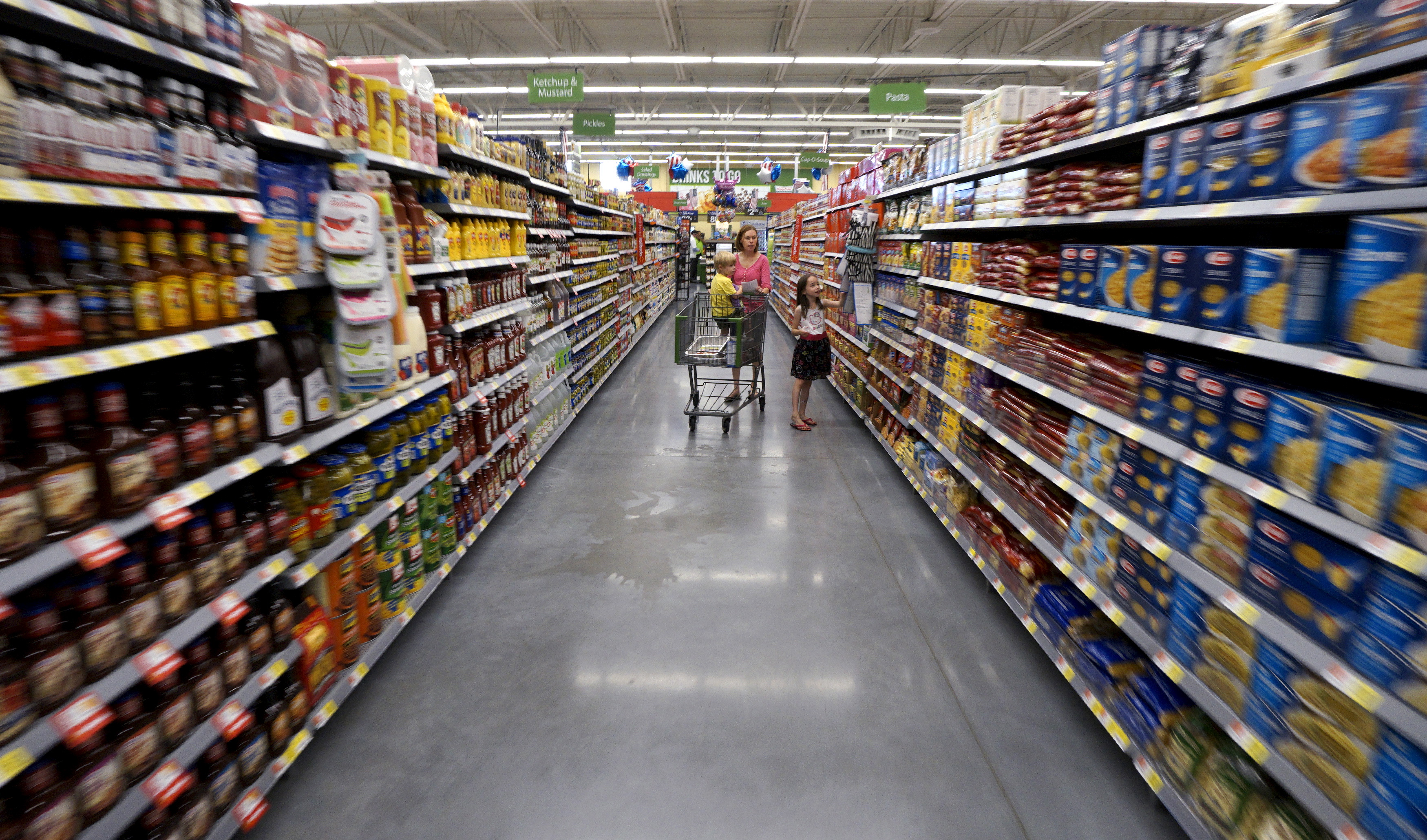 A family shops at the Wal-Mart Neighborhood Market in Bentonville