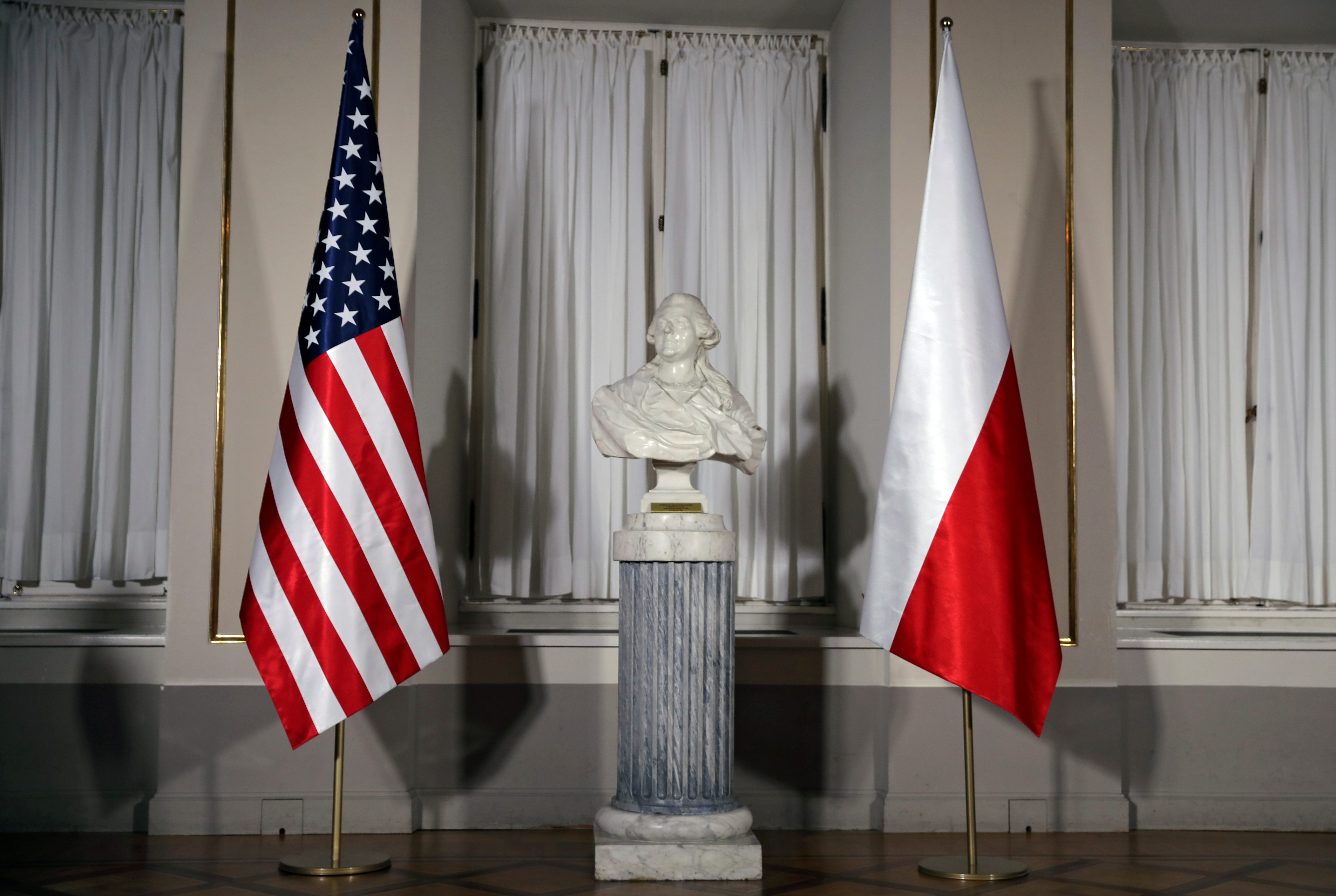A bust of Polish composer Frederic Chopin is flanked by U.S. and Polish flags ahead of the meeting between U.S. President Trump and Polish President Duda in Warsaw
