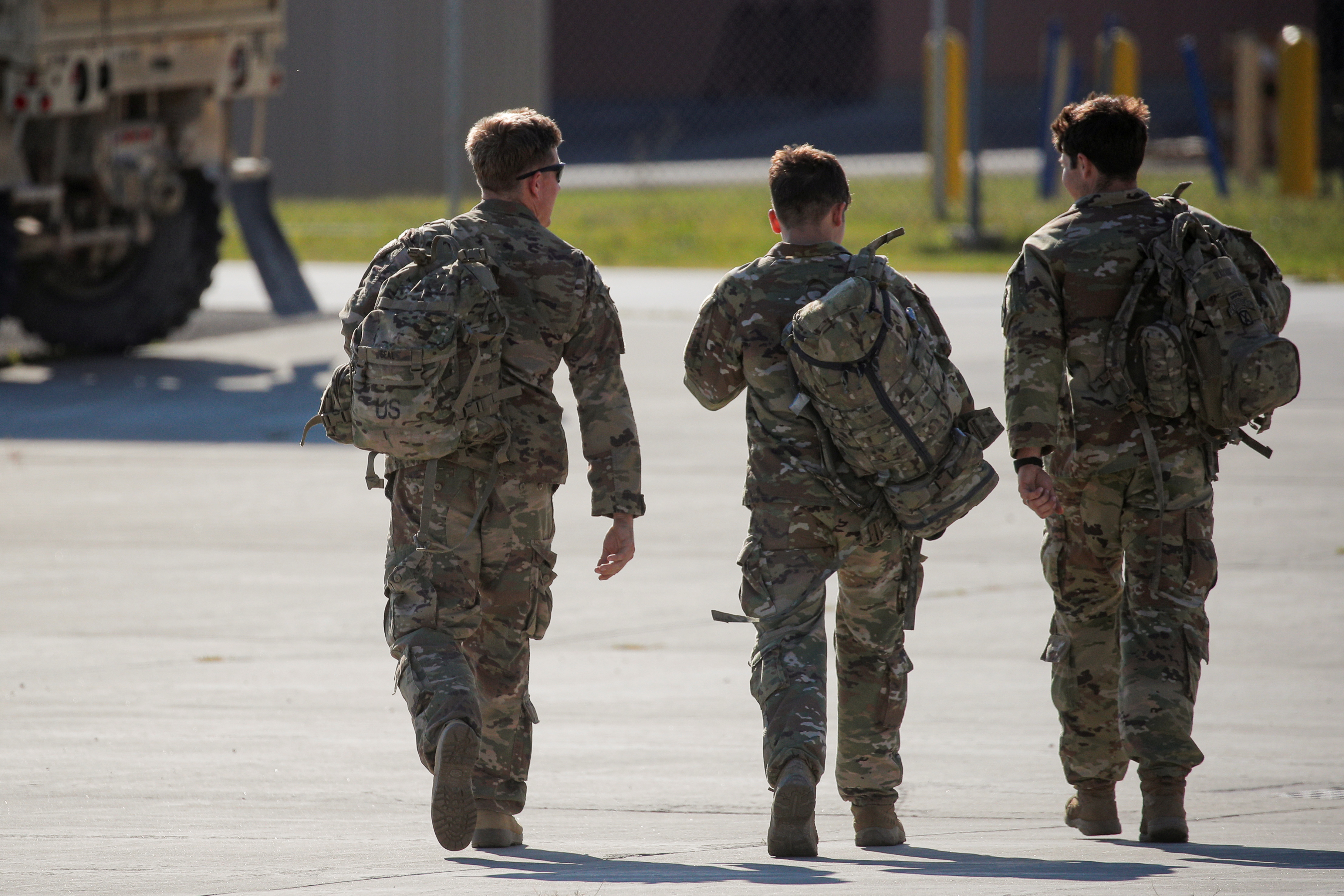 Soldiers walk together after returning home from deployment in Afghanistan, at Fort Drum, New York