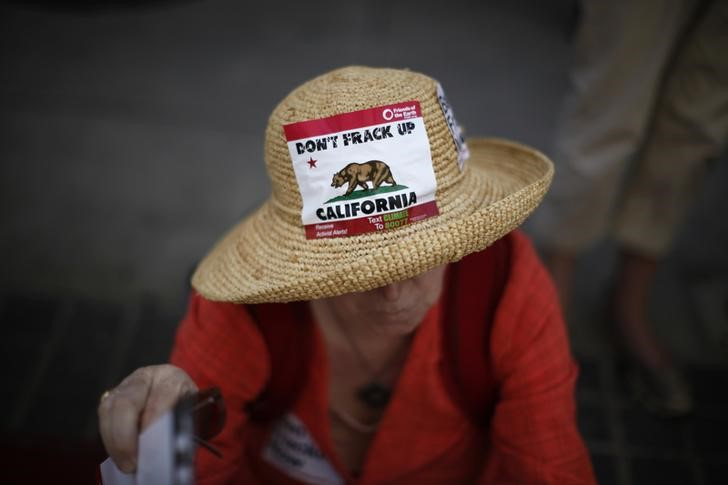A woman protests against fracking in California
