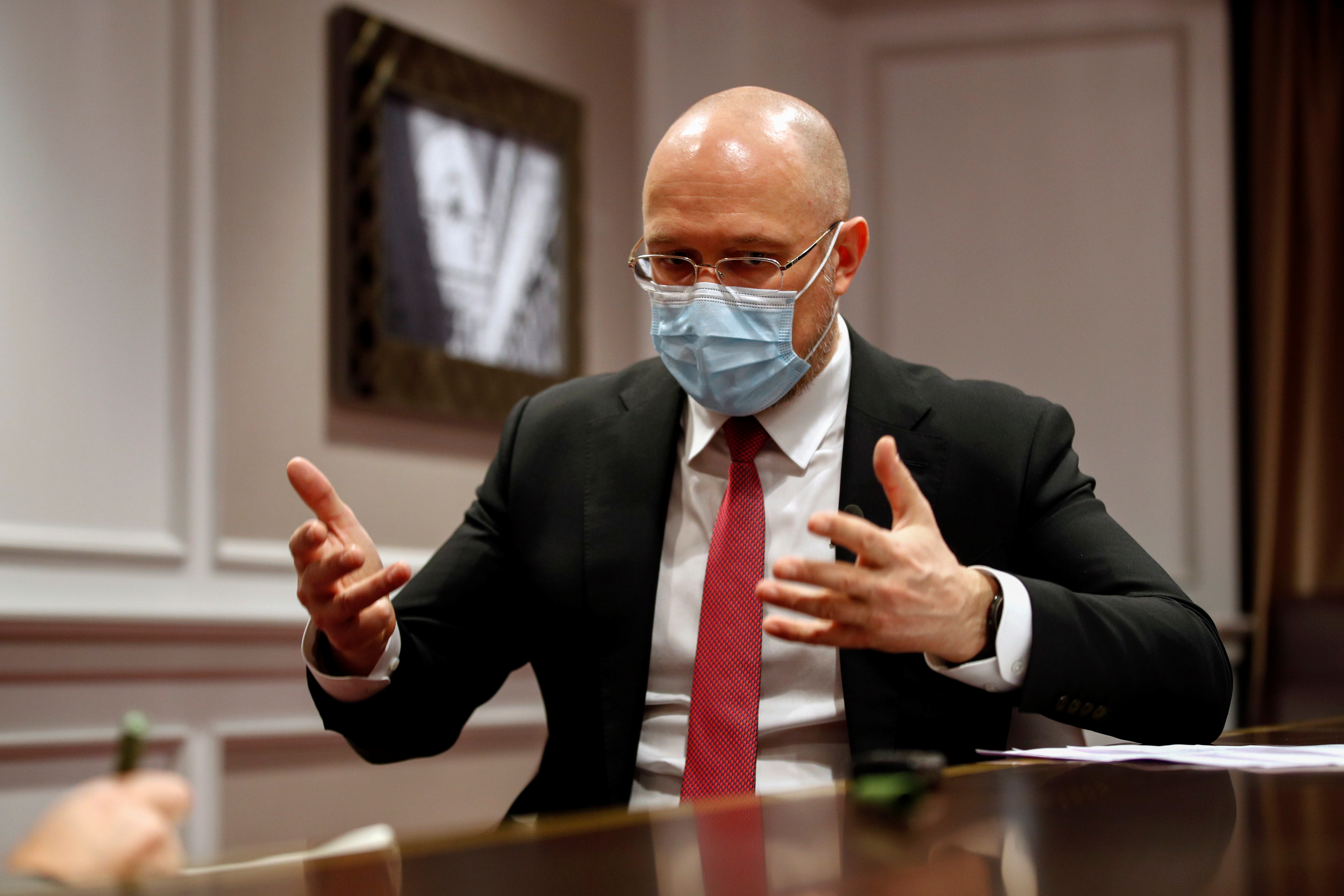 Ukraine's Prime Minister Denys Shmygal talks during an interview with Reuters in Brussels