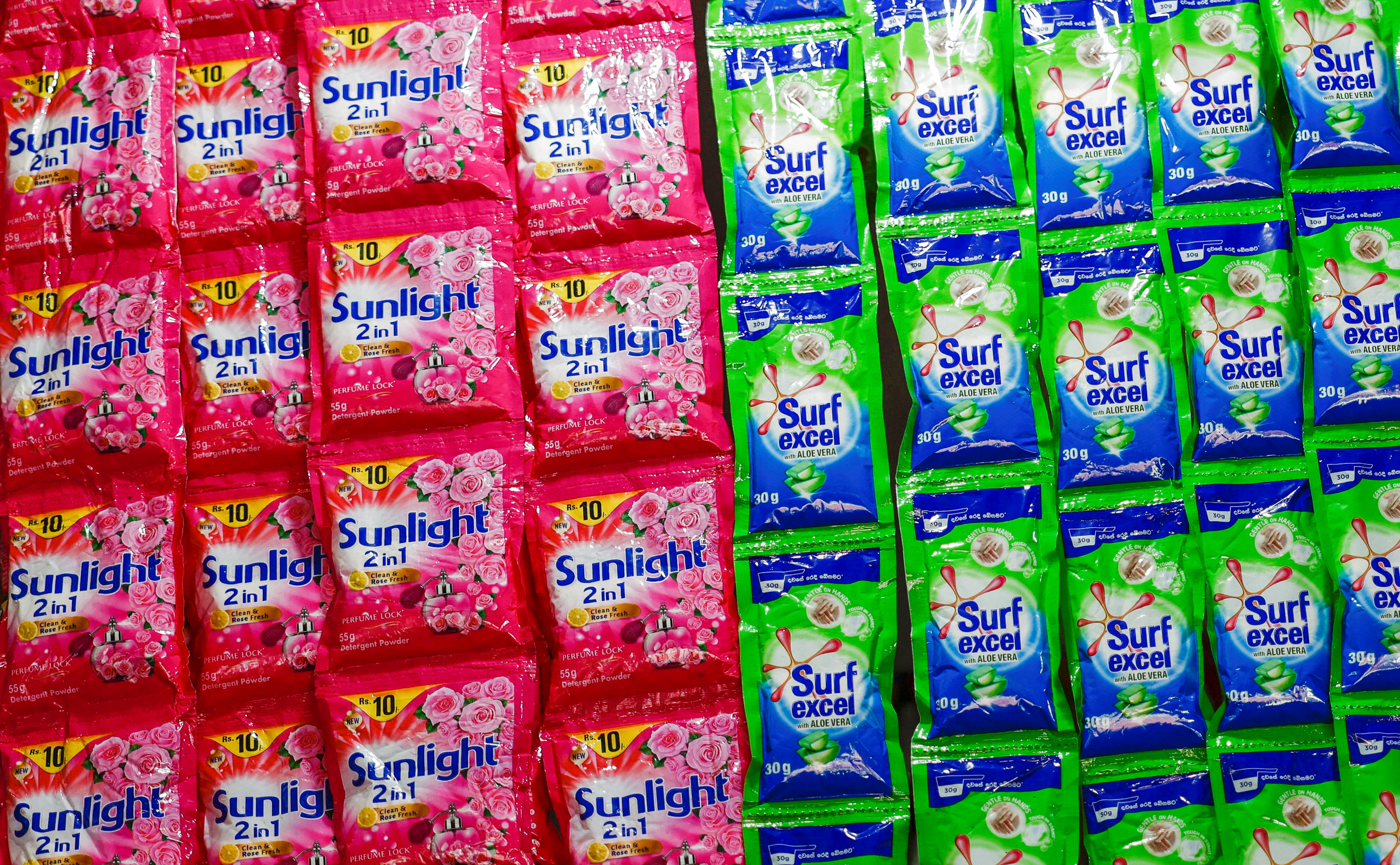 A view of plastic sachets of Unilever's Sunlight and Surf Excel laundry detergent at a shop in Colombo