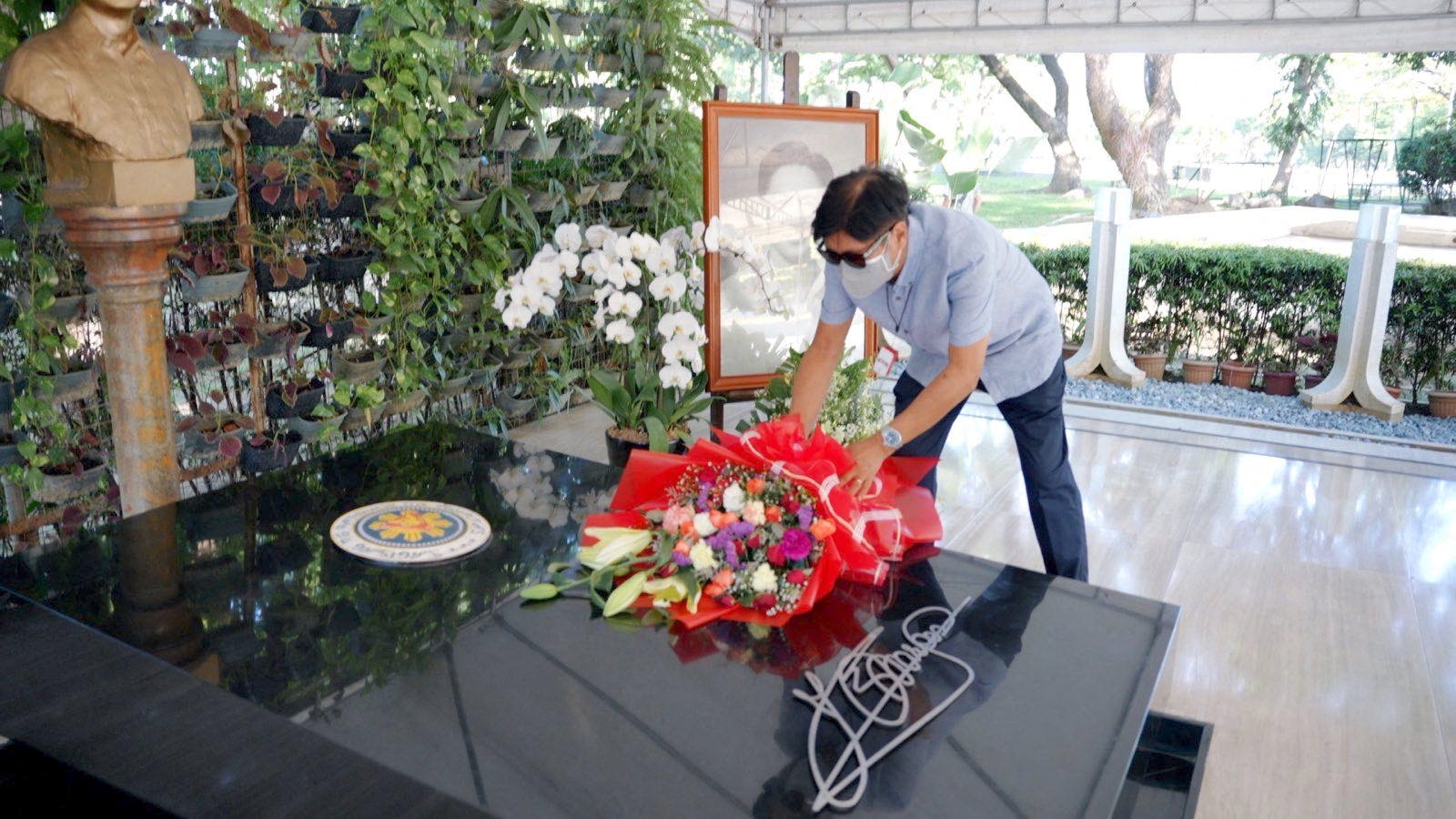 Presidential candidate Ferdinand "Bongbong" Marcos Jr. visits the grave of his father former President Ferdinand E. Marcos
