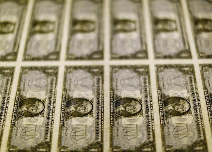 File photo of United States one dollar bills seen on a light table at the Bureau of Engraving and Printing in Washington