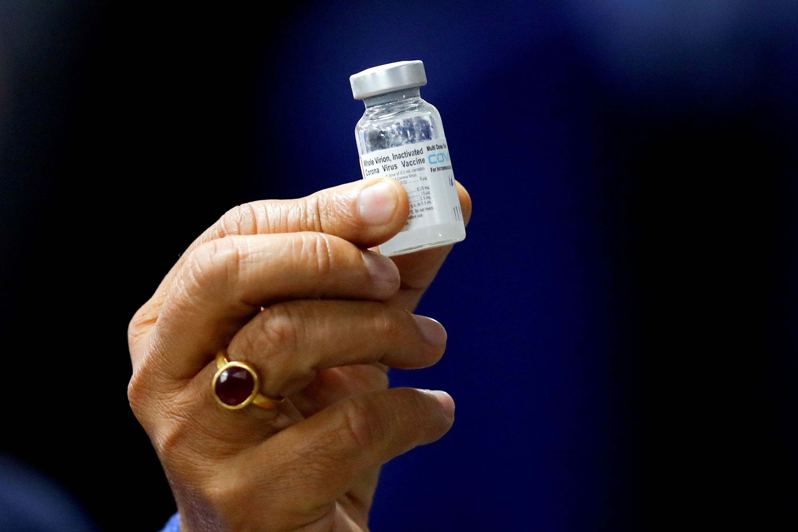 Indian Health Minister Harsh Vardhan holds a dose of Bharat Biotech's COVID-19 vaccine called COVAXIN, during a vaccination campaign at All India Institute of Medical Sciences (AIIMS) hospital in New Delhi, India, January 16, 2021. REUTERS/Adnan Abidi
