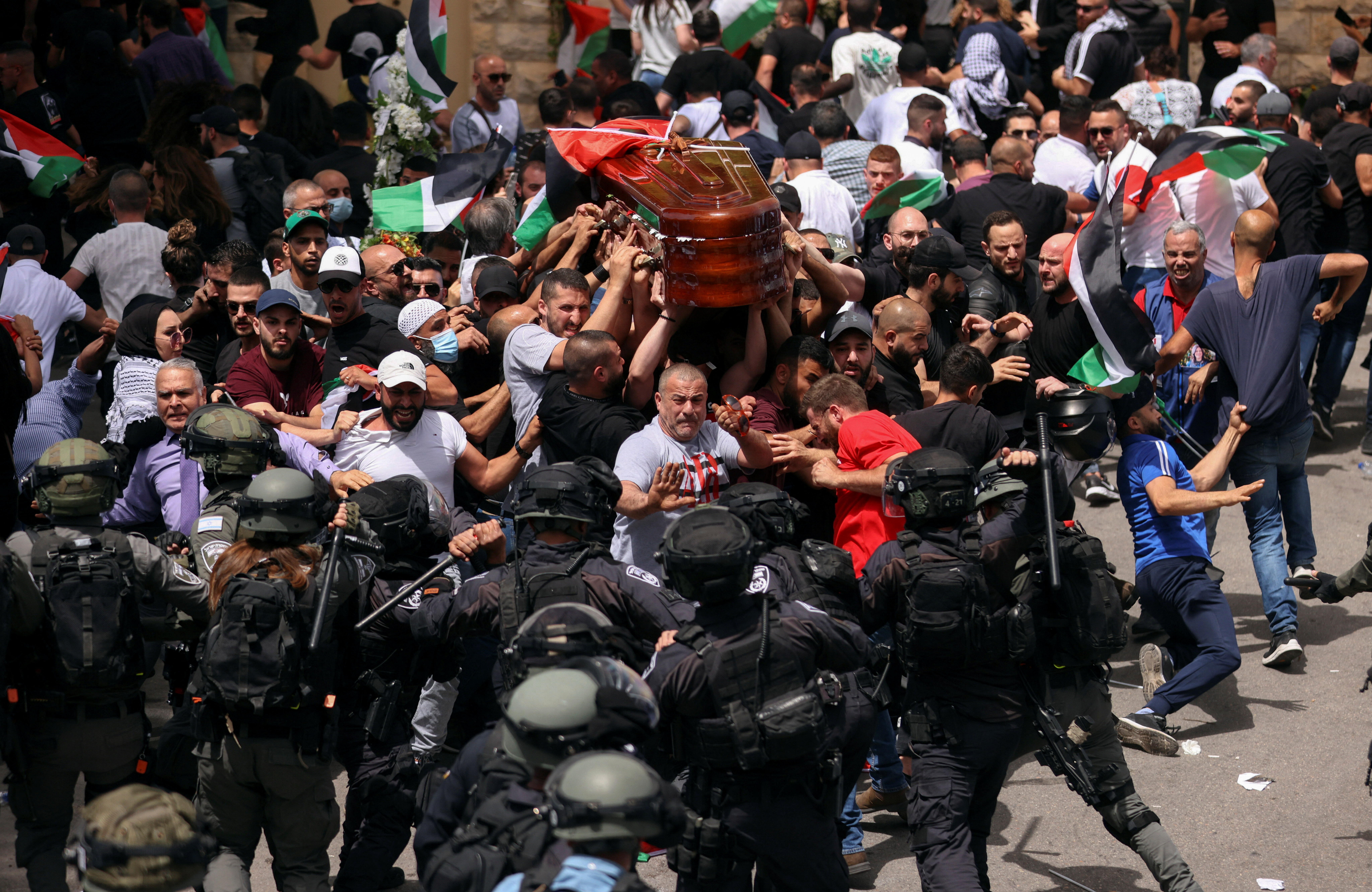 Family and friends carry the coffin of Al Jazeera reporter Shireen Abu Akleh during her funeral in Jerusalem