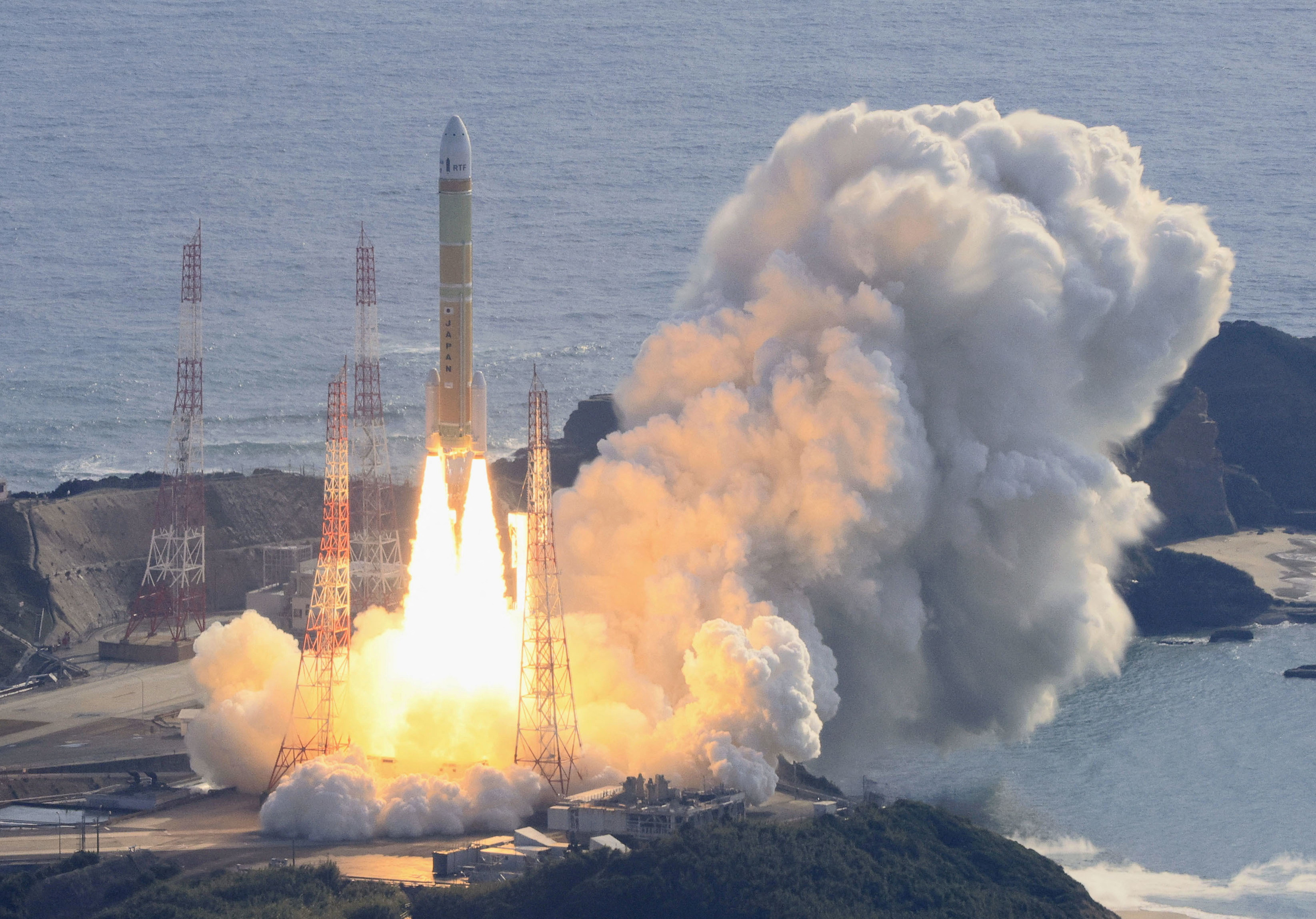An aerial view shows a second test model of H3 rocket lift off from the launching pad at Tanegashima Space Center on the southwestern island of Tanegashima