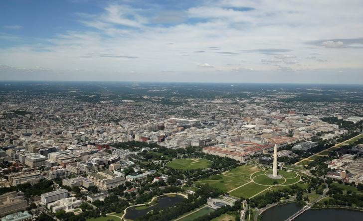 This aerial picture shows the Washington Monument standing on the National Mall and the White House at far left in Washington