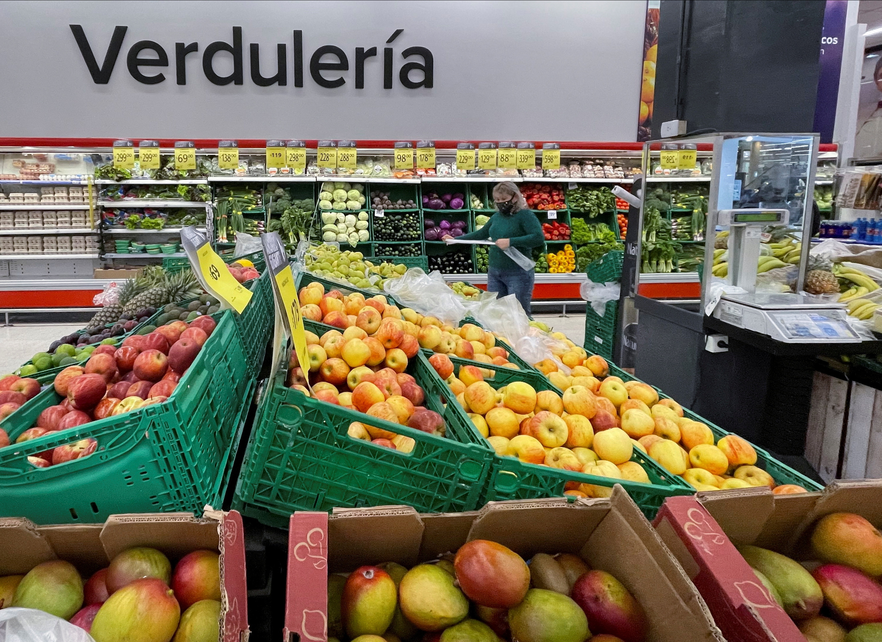 A woman shops in a supermarket, in Buenos Aires